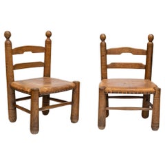 Set of 2  1930s oak wooden chairs leather upholstery seats by Charles Dudouyt
