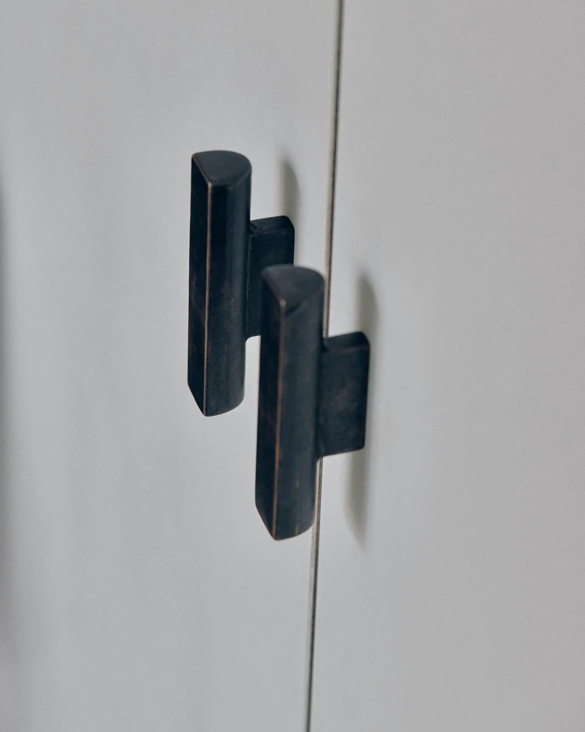Set of 2 ADT Blackened Brass Handle by Henry Wilson
Dimensions: D 3 x W 9 x H 1.8 cm
Materials: Blackened brass.

This simple, robust, and versatile handle can be used for cabinetry, sliding doors and sash windows. 
Each piece is sand-cast and