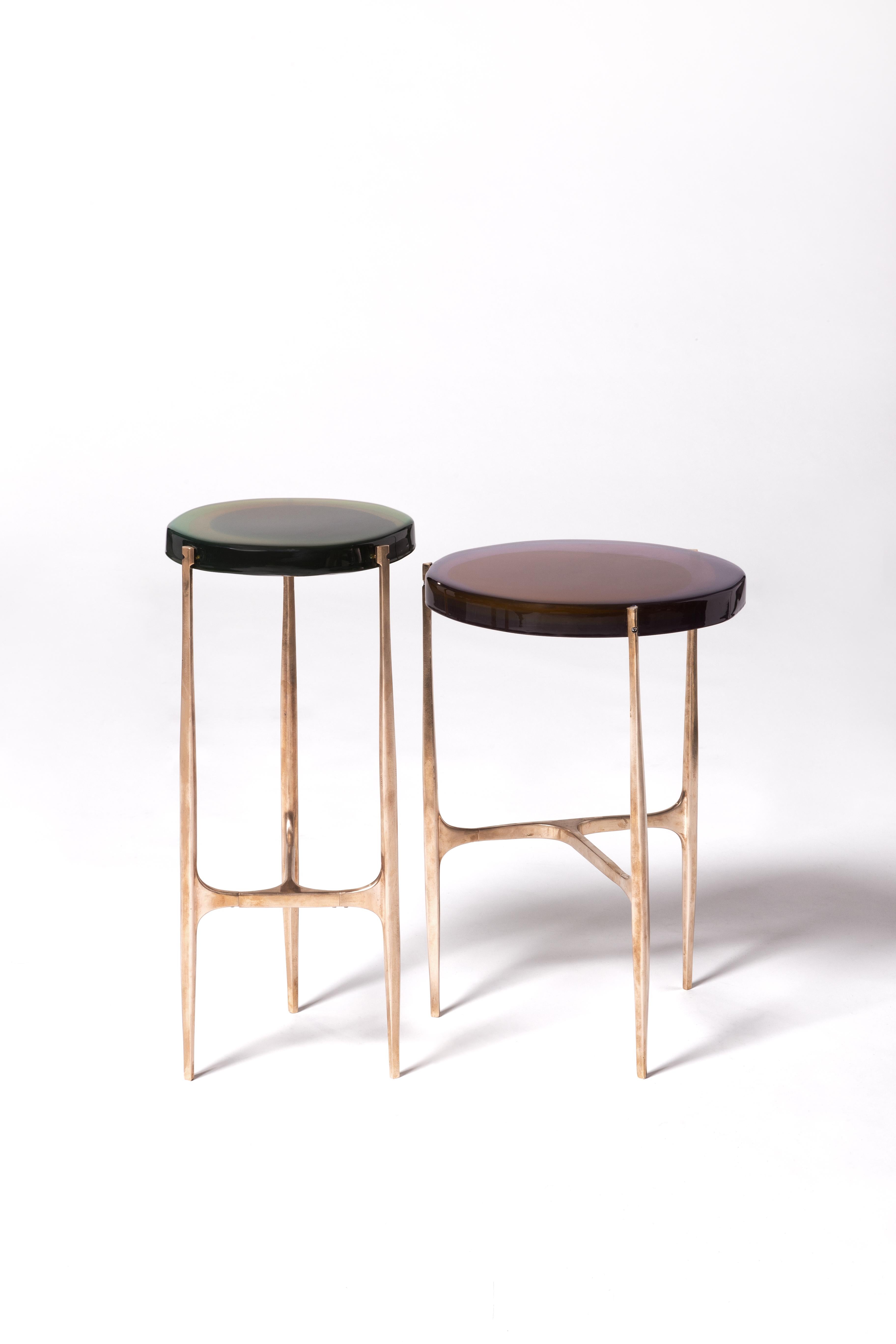 Set of 2 Agatha coffee table by Draga & Aurel
Dimensions: W 24 x D 24 x H 56, W 34 x D 34 x H 50
 top Ø 34 cm
Materials: Resin, bronze

The Agatha coffee tables are featured by irregular circular tops of transparent and
colorful resin sit on a