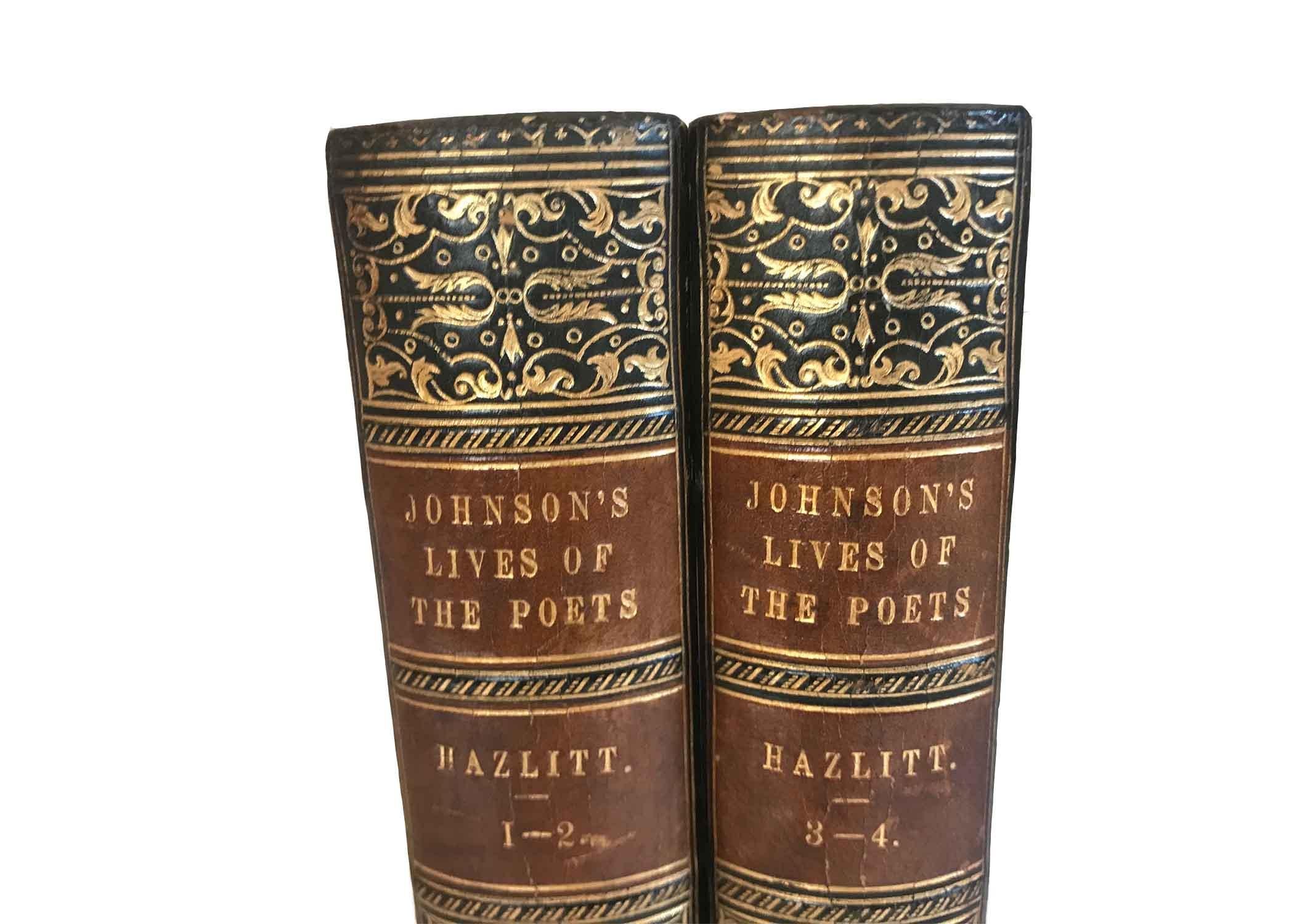 Set of two volumes of Johnson's Lives of the Poets with school crest of Rugby School. The spines are gold on blue leather.