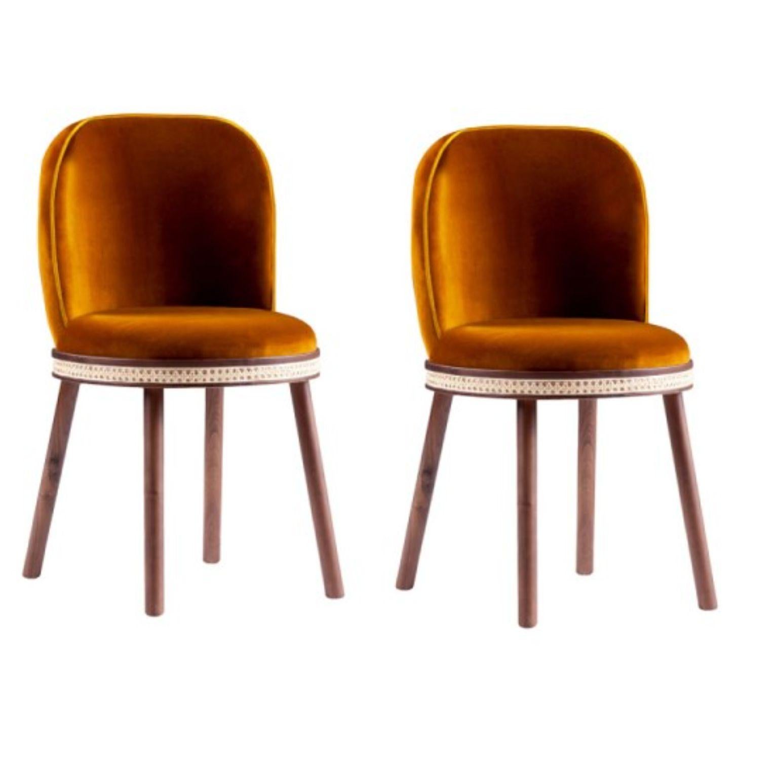 Set of 2 alma chairs by Dooq
Measures: W 51 cm 20”
D 53 cm 21”
H 86 cm 34”
seat height: 49 cm 19”

Materials: upholstery fabric or leather; structure solid wood feet lacquered MDF or solid wood rattan natural rattan. COM with natural walnut or