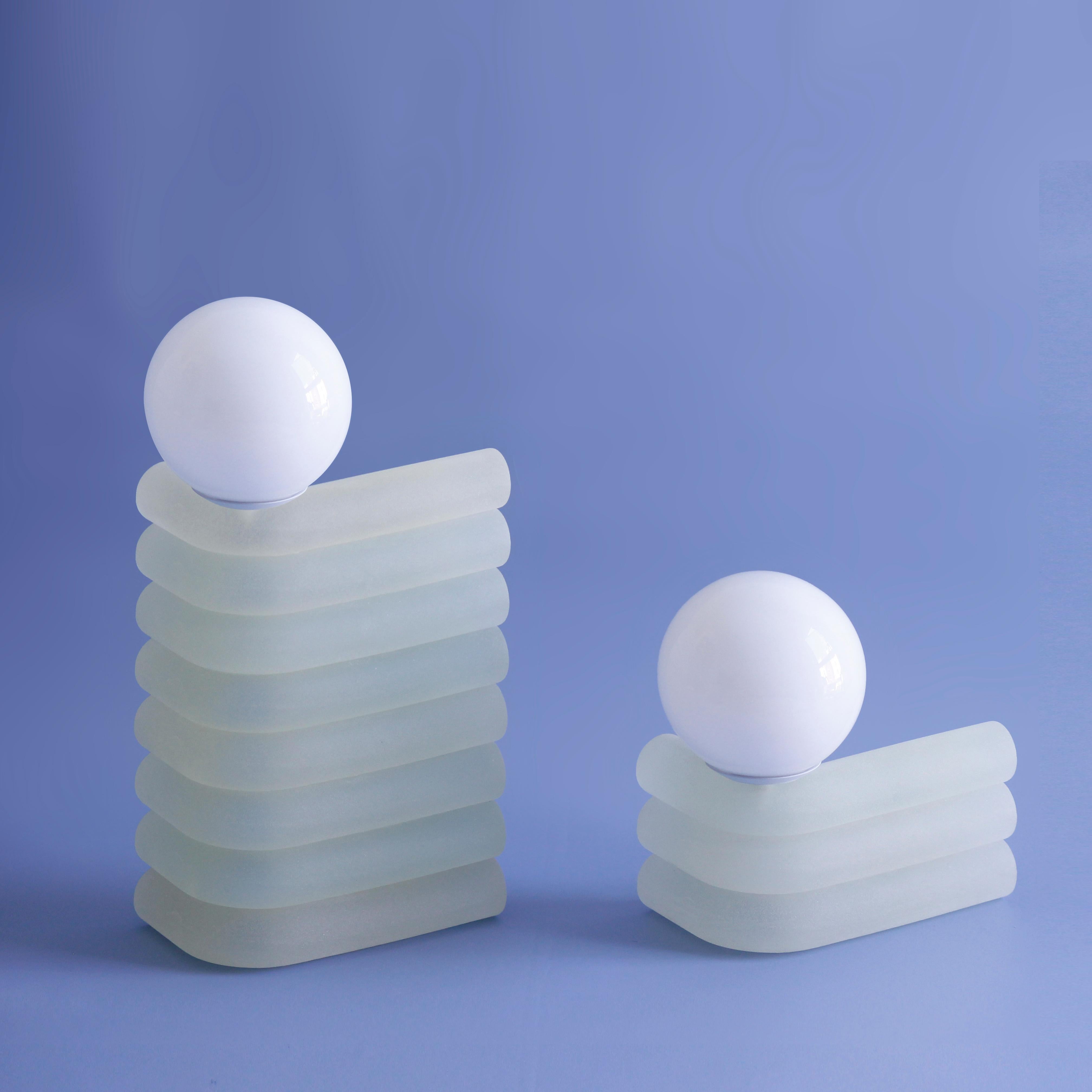 Set of 2 Aloe Elio lamp by Soft-Geometry
Materials: Voice-controlled smart lamp, hand-cast in textured resin
Dimensions: W27.94 x D17.78 x H45.73 cm and W27.94 x D17.78 x H22.86 cm

Voice-controlled smart lamp

Inspired by an informal photo