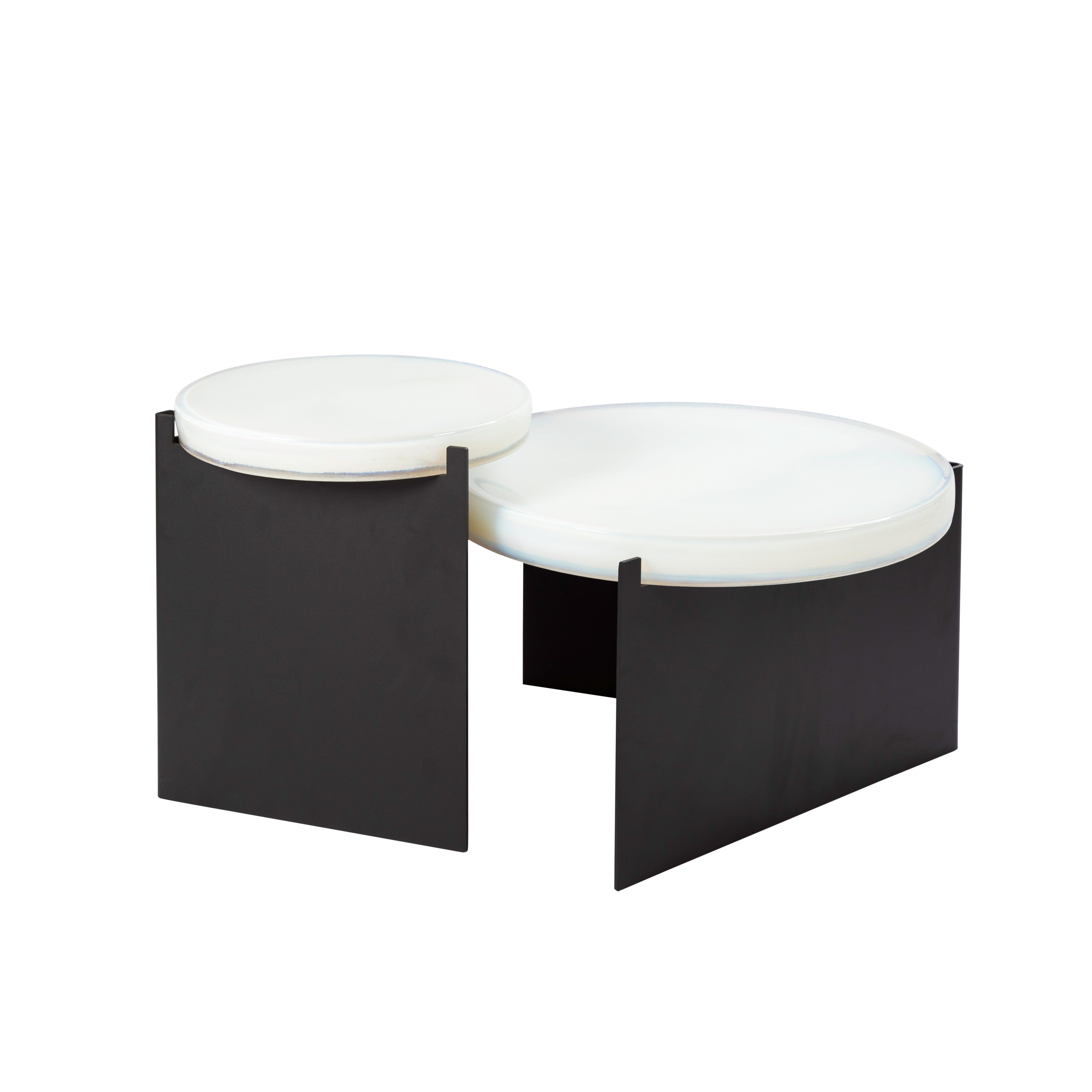Set of 2 Alwa one tables by Pulpo
Dimensions: D56 x H35 cm // D38 x H 44 cm.
Materials: casted glass; powder coated steel.

Also available in different finishes. 

Normally, glass is regarded as being lightweight with sharp edges. In contrast,