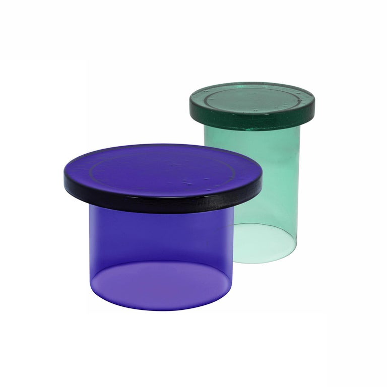 Set of 2 Alwa three tables by Pulpo.
Dimensions: D56 x H35 cm // D38 x H44 cm.
Materials: casted and handblown glass.

Also available in different colours. 

Normally, glass is regarded as being lightweight with sharp edges. In contrast,