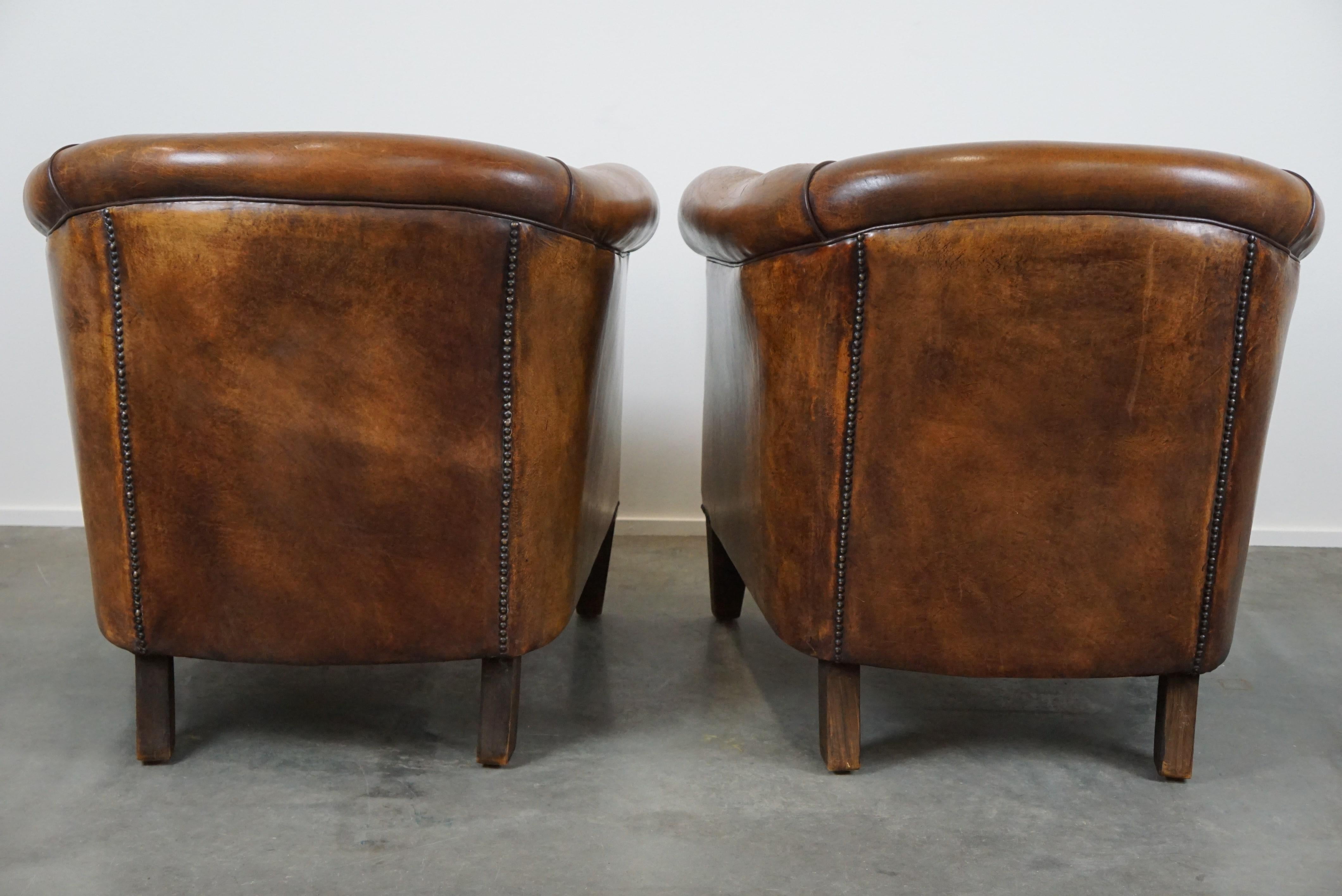 Romantic Set of 2 amazing and characterful sheep leather club armchairs with warm color For Sale