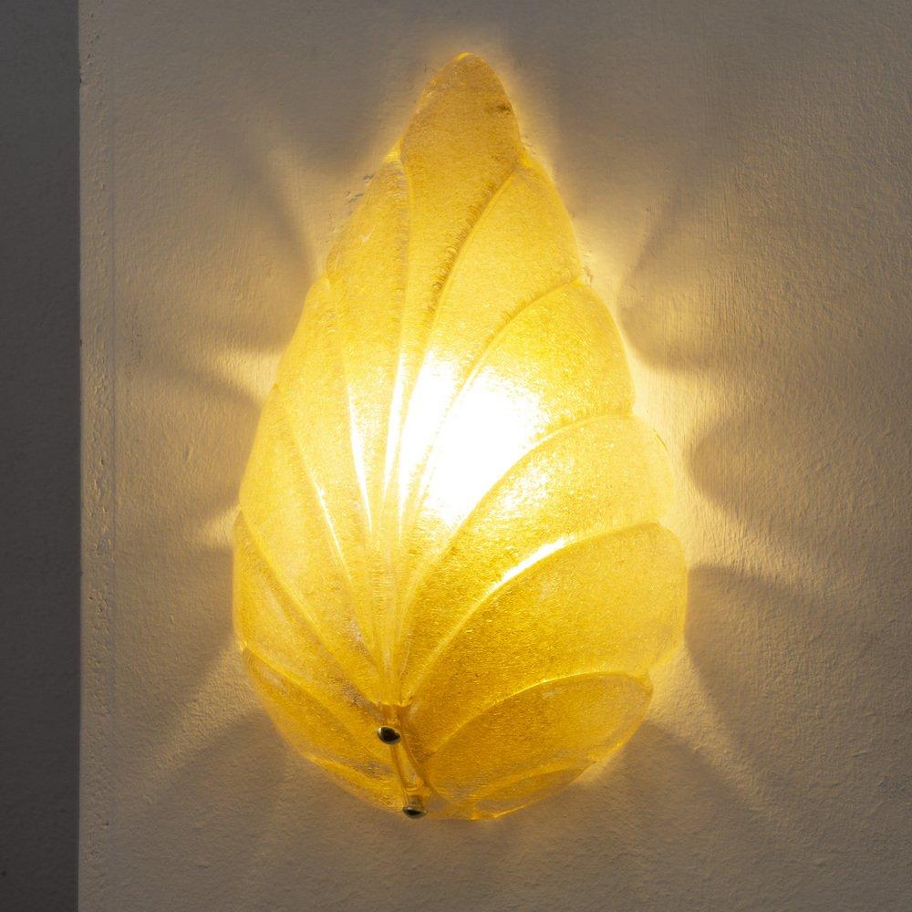 Juego de 2 apliques de hoja de cristal de Murano con arenilla, color ámbar y estructura de latón, aplique de pared Made in Italy

Más información:
Material: Cristal de Murano
Estilo: Mediados de siglo, Art Decó
Color: Dorado
Periodo de diseño: 1950