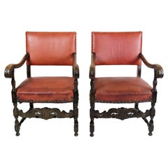 Ensemble de 2 fauteuils anciens en chêne et en cuir rouge des années 1930
