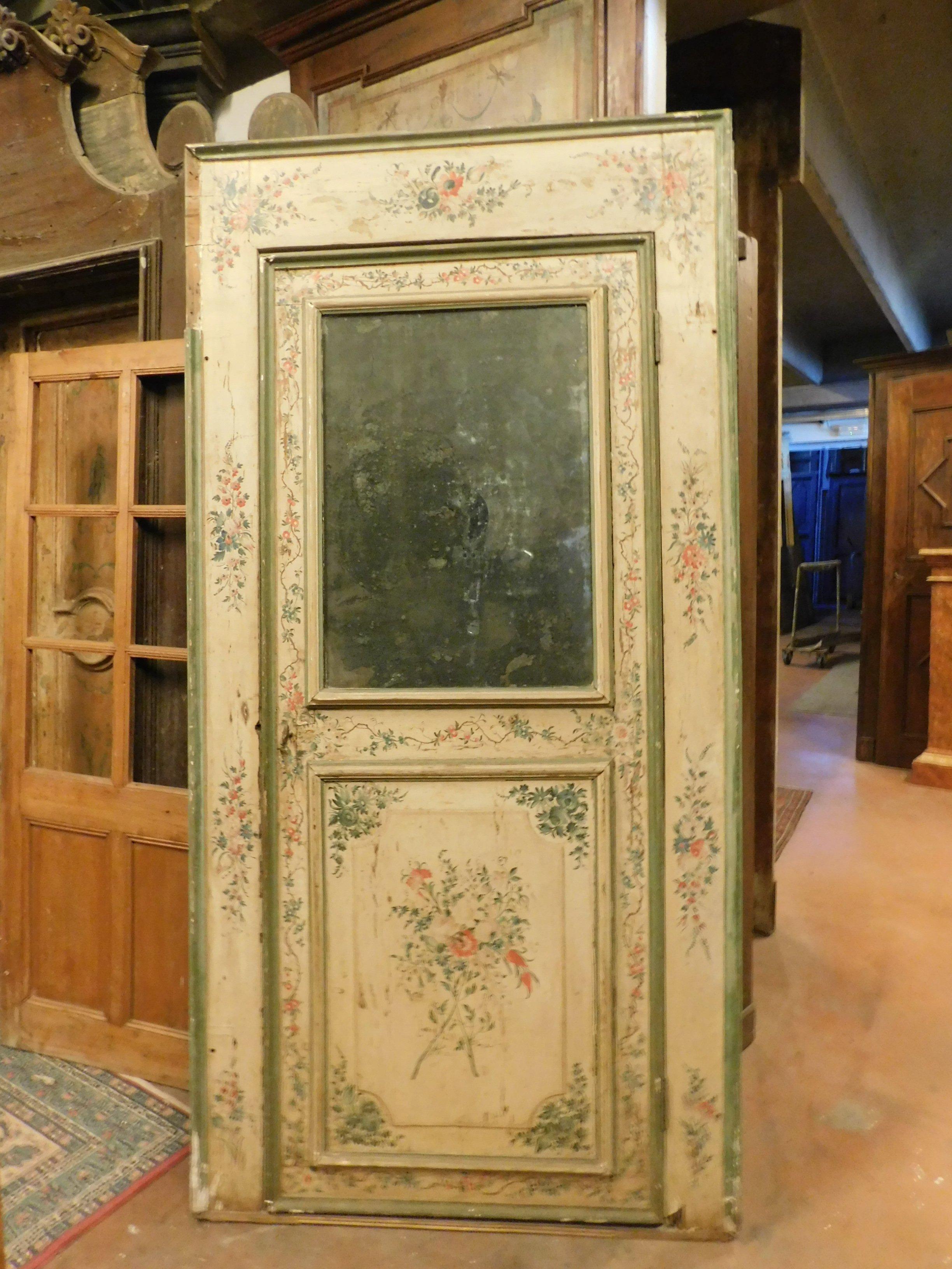 Set of 2 antique doors, different in size but both with the same design, interior wooden doors, richly painted with colorful flowers on a beige background and mirror on high panel, mirror and original frame, built in the 18th century in Italy for a