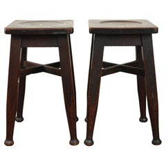Set of 2 Antique English solid oak stools with a touch of art nouveau style.