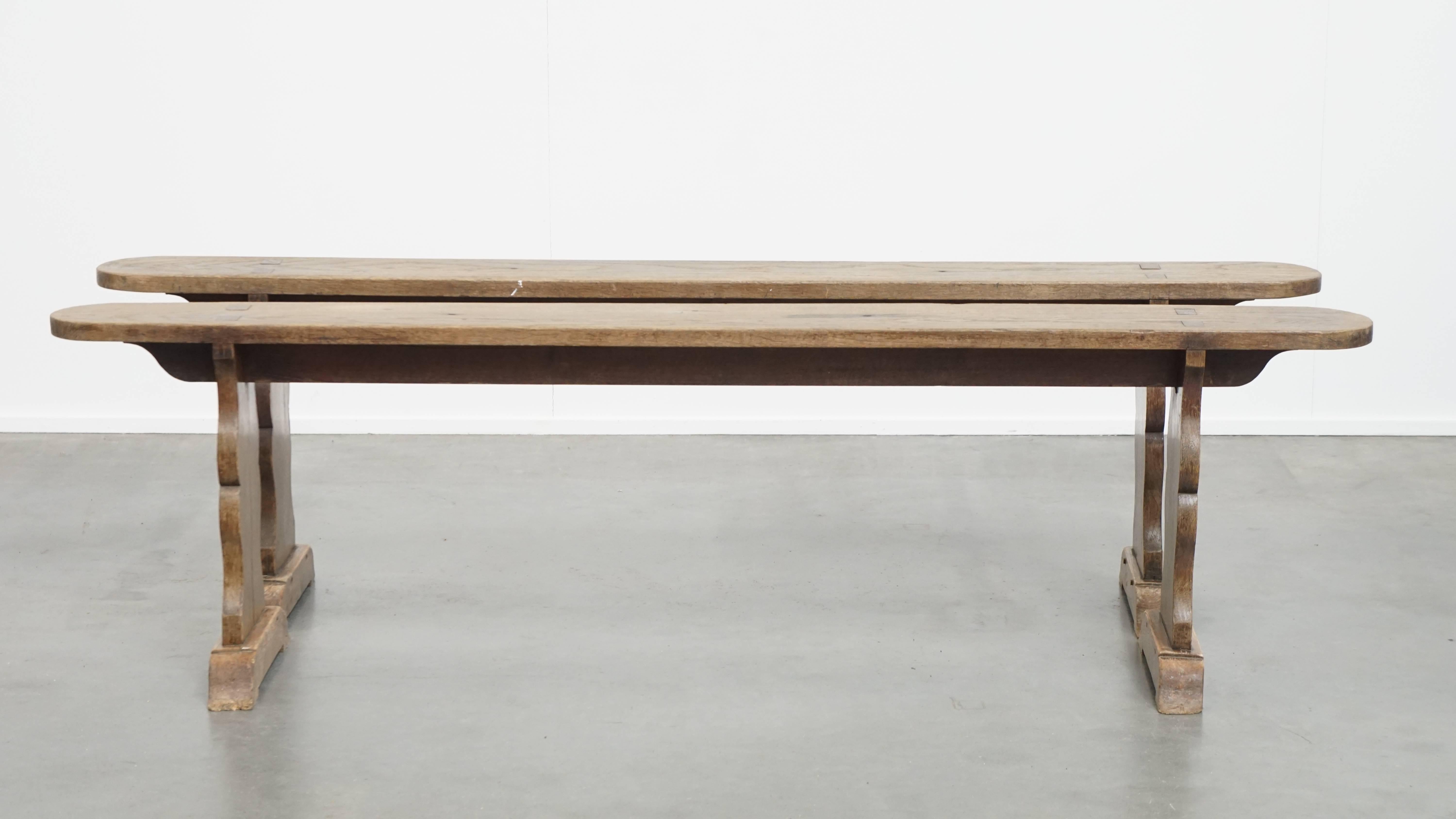 Offered is this beautiful set of 2 antique French hall benches, perfect for use at the dining table, with a stunning patina. 

For lovers of a charming and warm interior, it’s no secret—a bench is always a stylish and practical addition to nearly