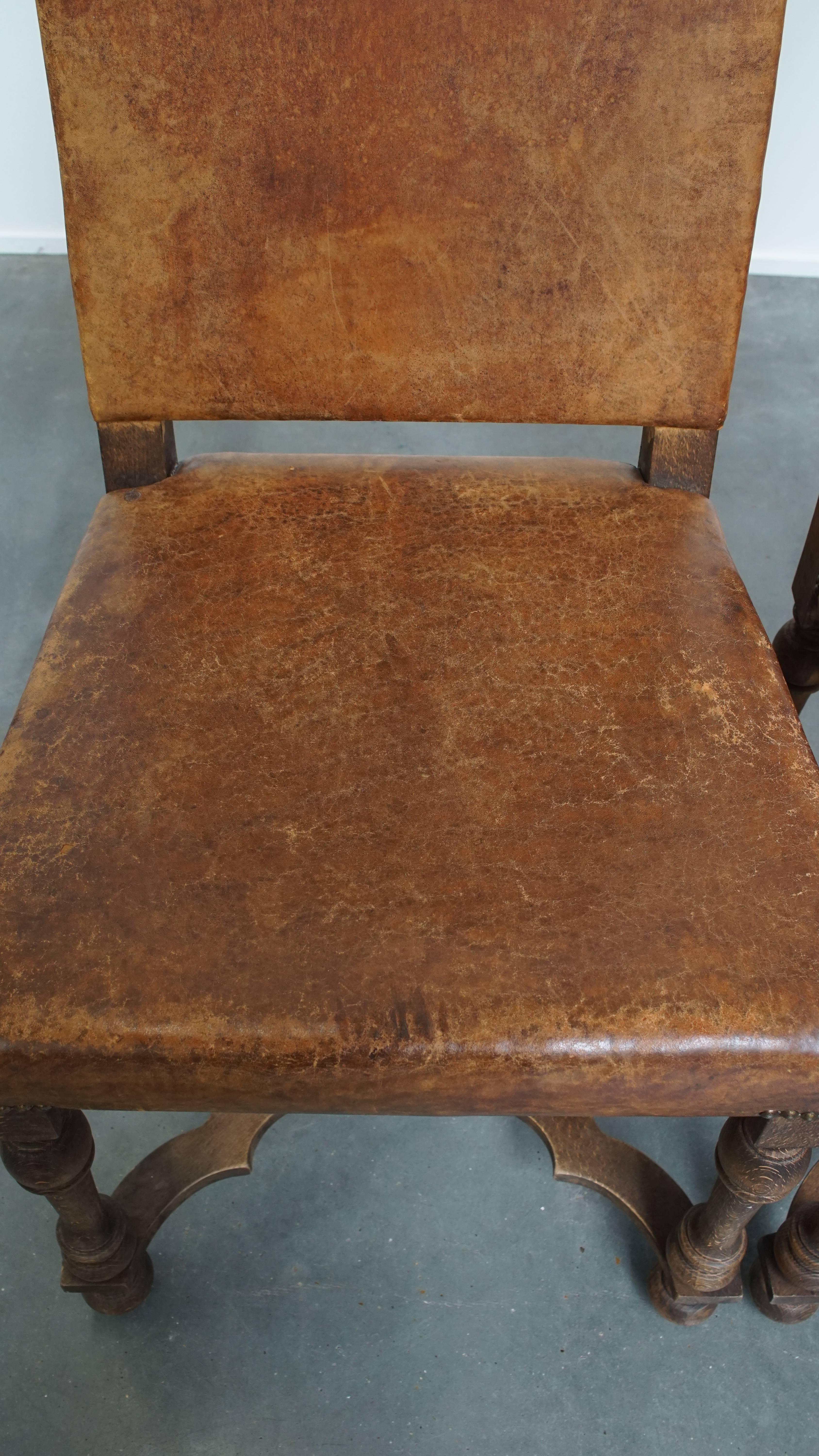 Set of 2 Antique Wooden and Sheepskin Leather Dining Chairs from the Early 1900s In Fair Condition For Sale In Harderwijk, NL