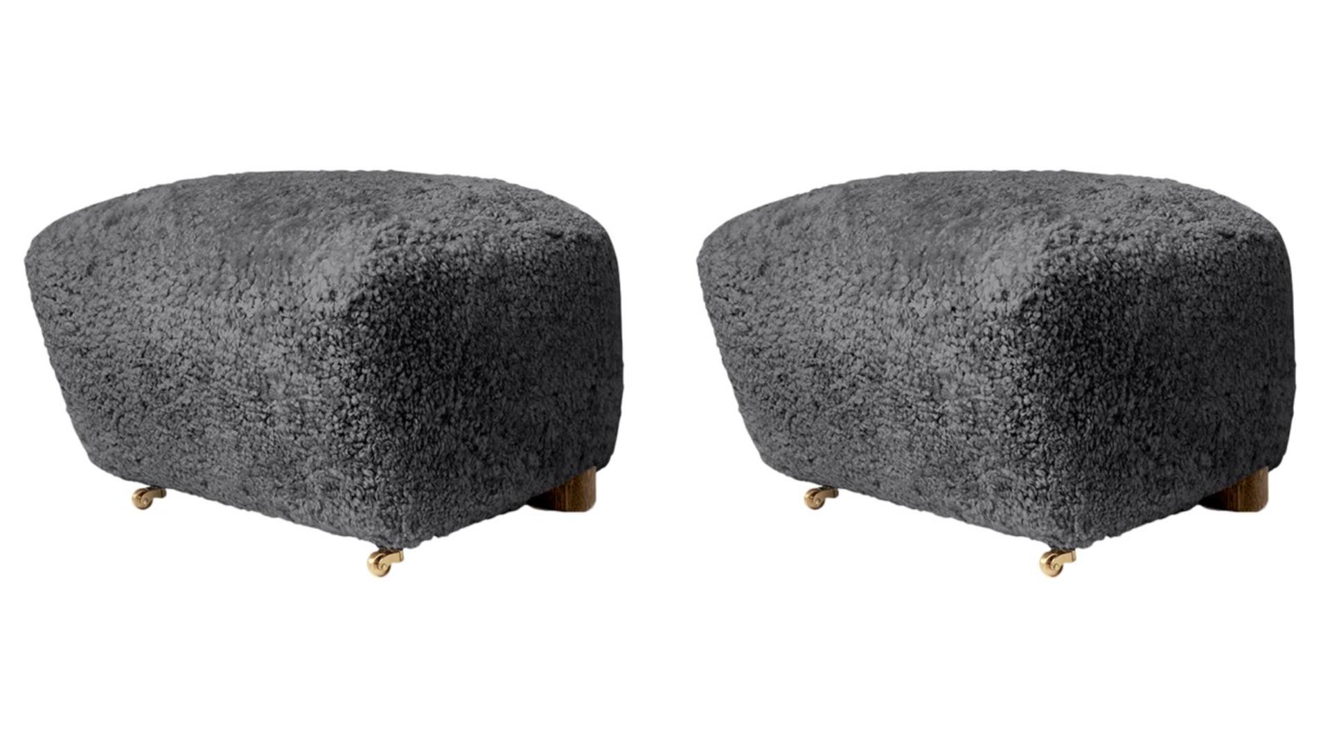 Set of 2 antrachite smoked oak sheepskin the tired man footstools by Lassen
Dimensions: W 55 x D 53 x H 36 cm 
Materials: Sheepskin.

Flemming Lassen designed the overstuffed easy chair, the tired man, for The Copenhagen Cabinetmakers’ Guild