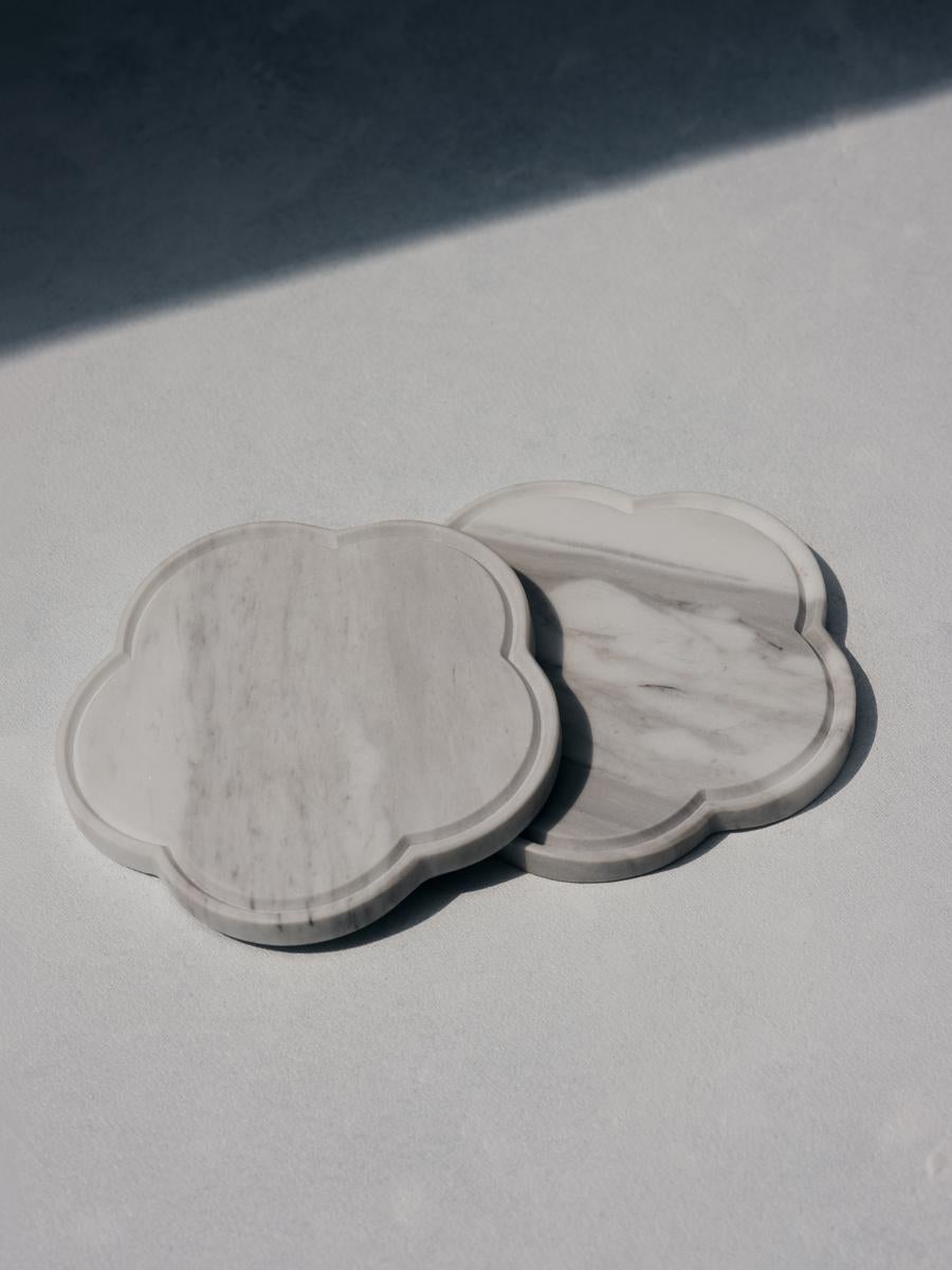 Set of 2 ariadne coasters in white volakas marble by Faye Tsakalides. 
Dimensions: 12 W x 12 L x 1 H cm
Materials: White volakas marble. 
Technique: Crafted from a single piece of marble. Hand-crafted, Polished. Mat finished. 

Faye Tsakalides