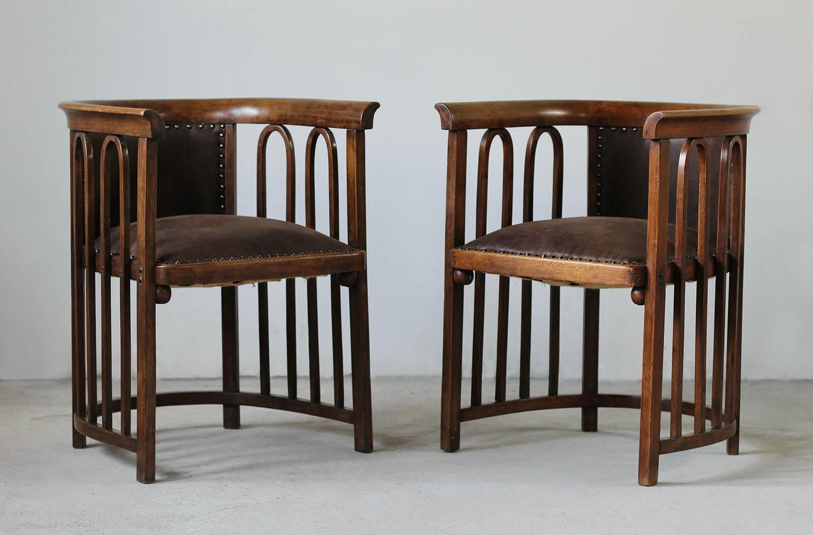 Set of two Armchairs designed by famous Josef Hoffmann. One of his iconic models – number 423. The armchairs have been professionally restored and reupholstered with high quality leather in chocolate brown color. The wooden elements have been