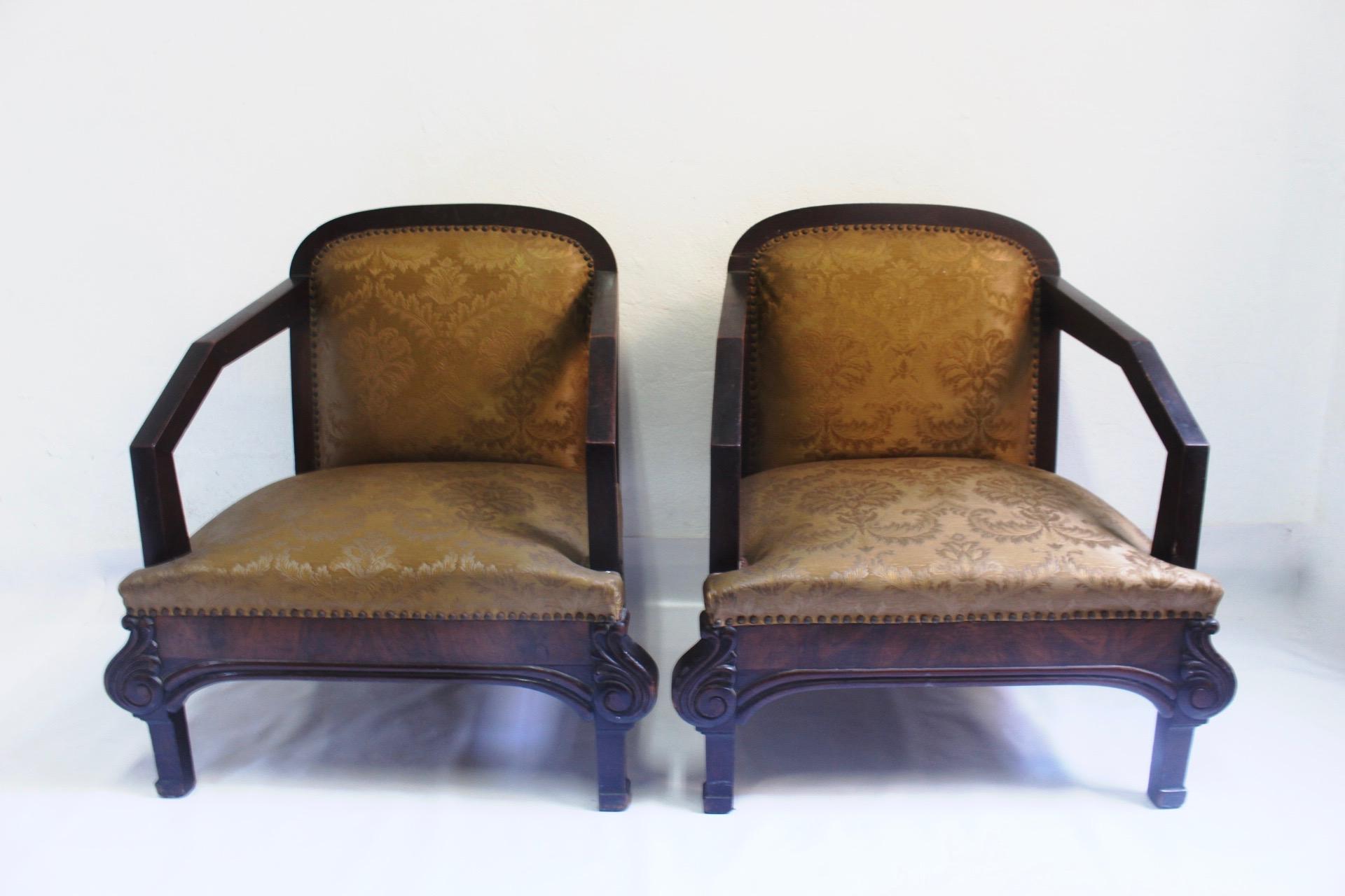 Pair of 2 Art Deco club armchairs made in  Spain with  its original golden brocade silk upholstery from the 1930s.  A transition, very common in Spain, between the voluptuous forms of the Art Nouveau and the Geometric lines of the Art Deco. 
This