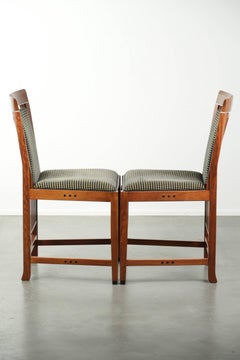 Set of 2 Art Deco design dining chairs with fabric upholstery