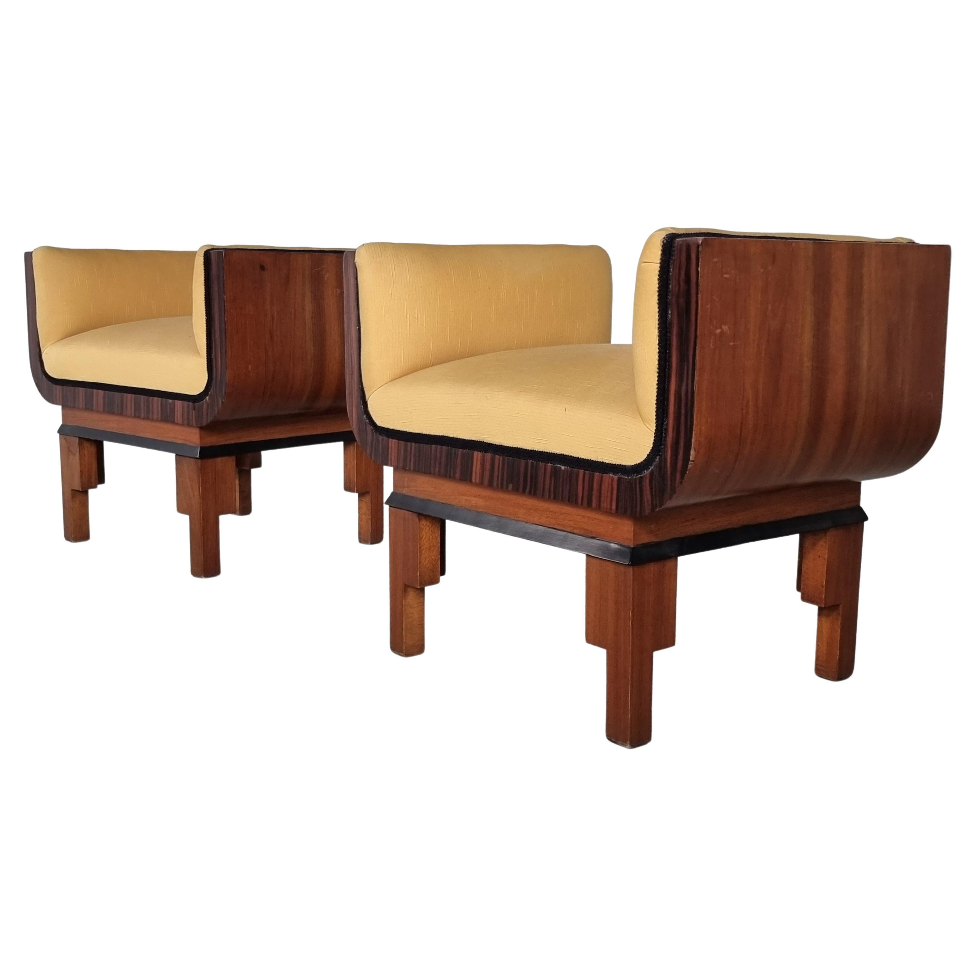 This Pair of Art Deco-style benches from the 1960s. The base is made of walnut and rosewood veneer. The set is perfect if you want to bring a classy look into your home. A timeless piece that is also a perfect complement to the master bedroom at the
