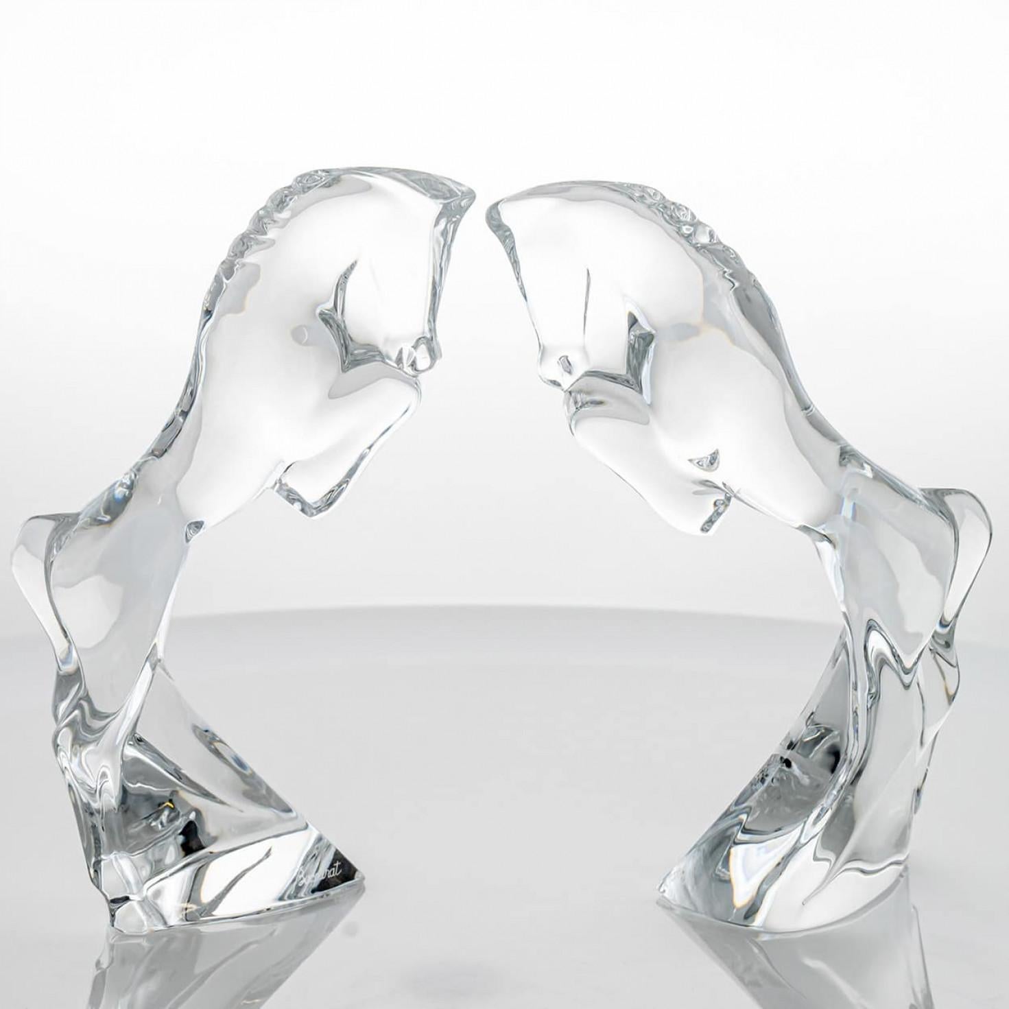 Luxury at its finest, high-end glass sculpture by Allison Hawkes for Baccarat, France.

The sculptures are two horses. The horses, made from clear crystal, are rearing up on their hind legs .

Please notice the price is for the set.

Baccarat is a