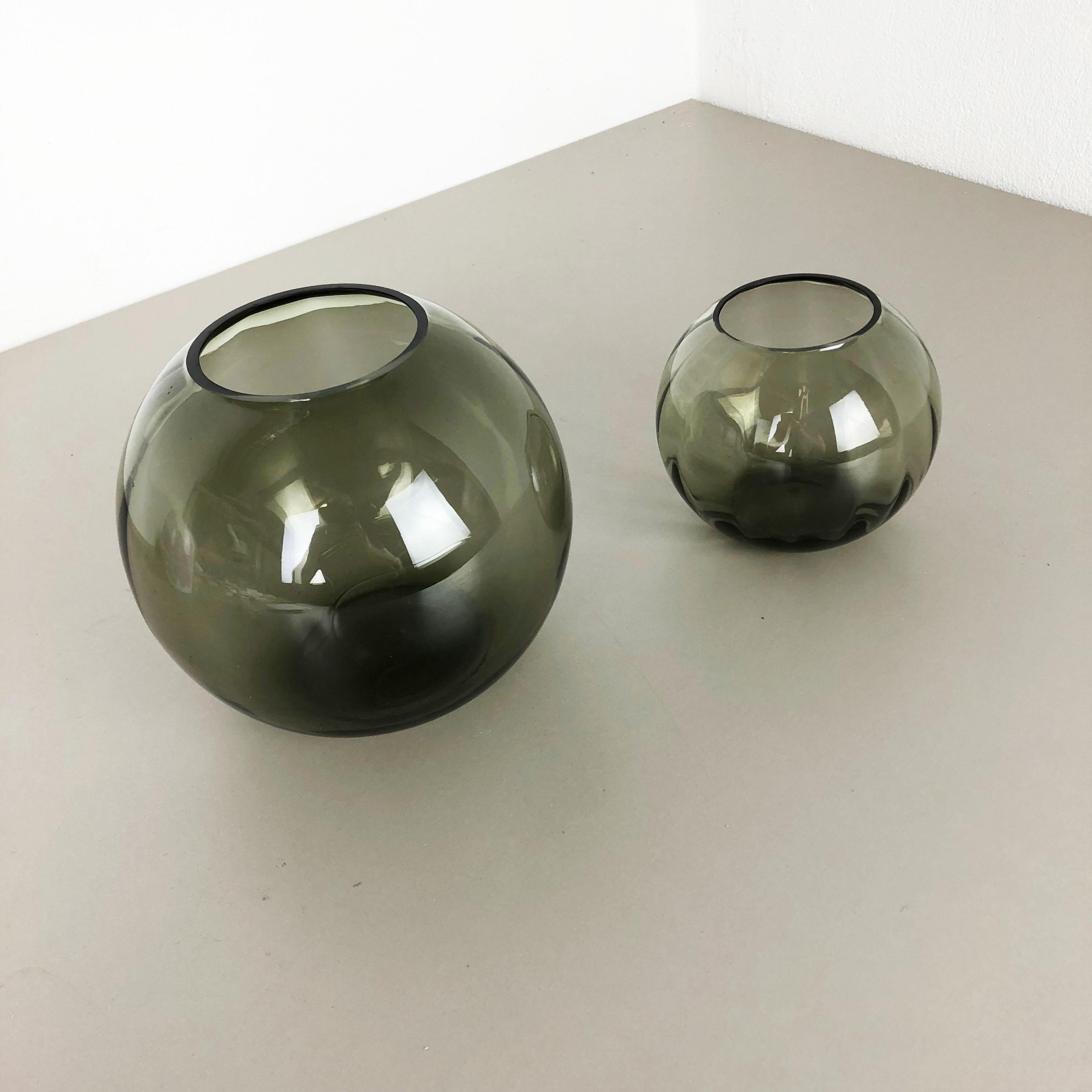 Article:

Set of two Turmalin Vases


Producer:

WMF, Germany


Design:

Prof. Wilhelm Wagenfeld BAUHAUS



Decade:

1960s


Original vintage 1960s set of 2 Vases of the Wagenfeld Turmalin series. These two vase are designed by