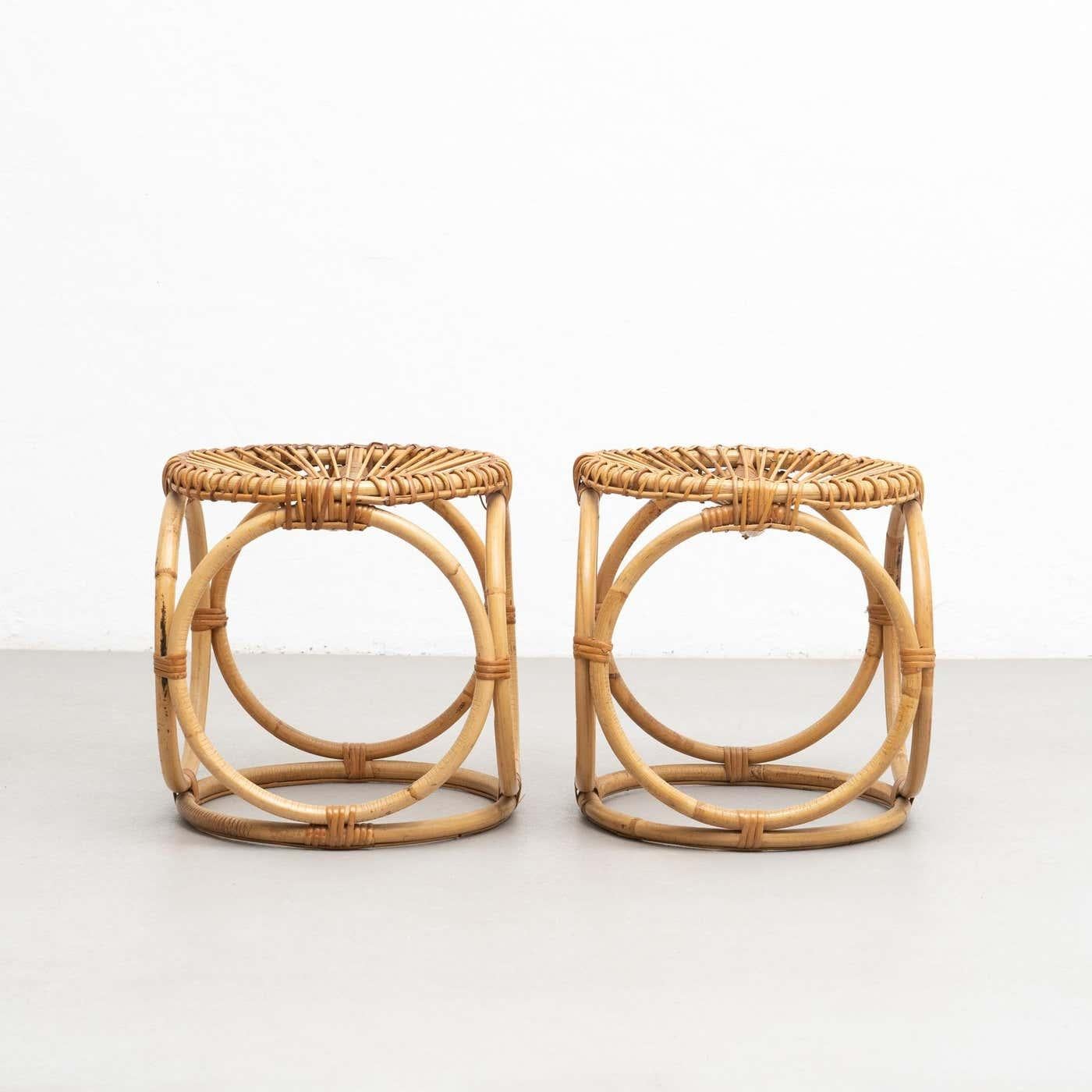 Mid-Century Modern pair of bamboo and rattan handcrafted stools , circa 1960.

Traditionally manufactured in France.

By unknown designer.

In original condition with minor wear consistent of age and use, preserving a beautiful patina.

