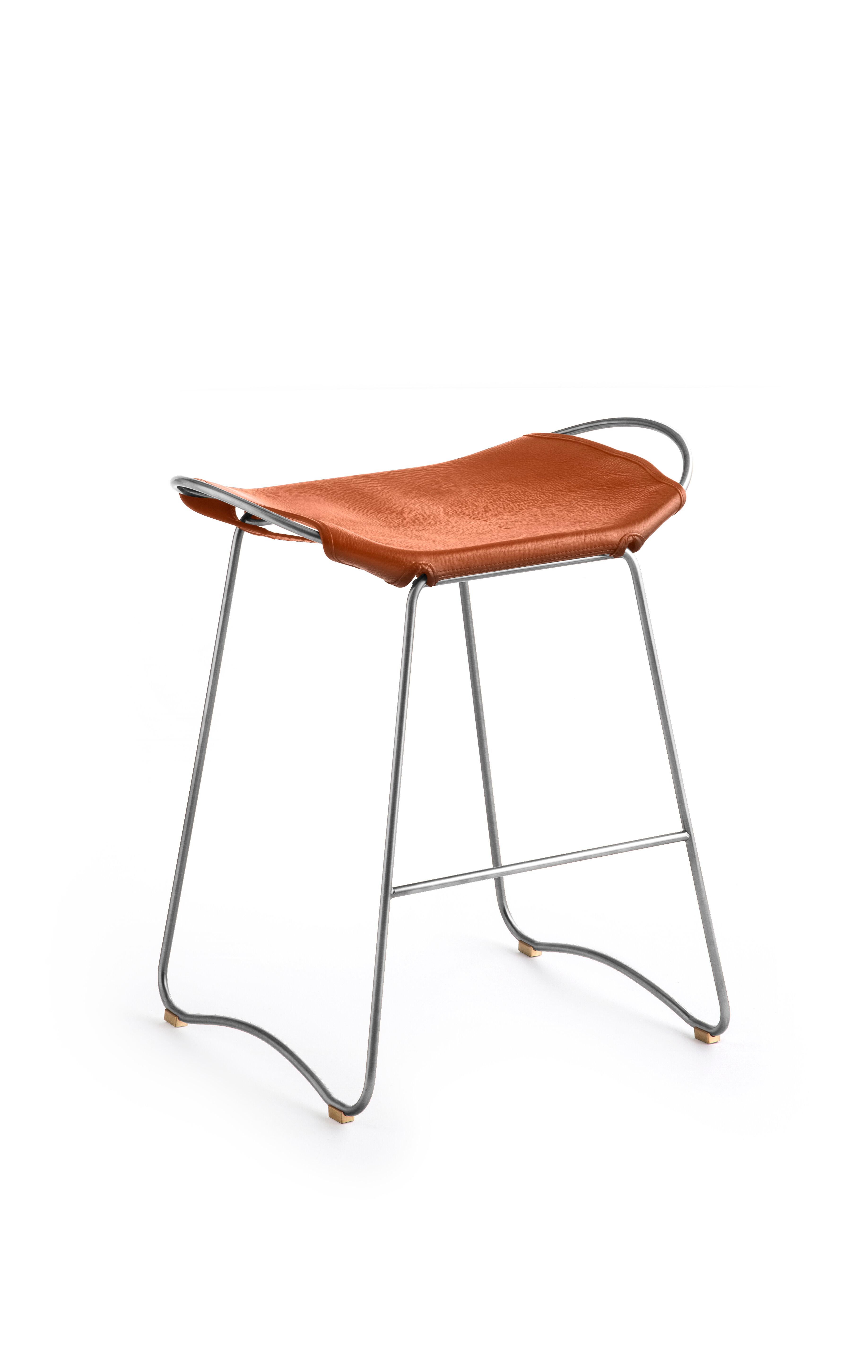 The Hug contemporary barstool is designed and conceived with a light aesthetic, the slight oscillation of the steel rod of 12 mm is complemented by the flexibility of the double 3.5 mm thick leather. When sitting in this furniture you feel an