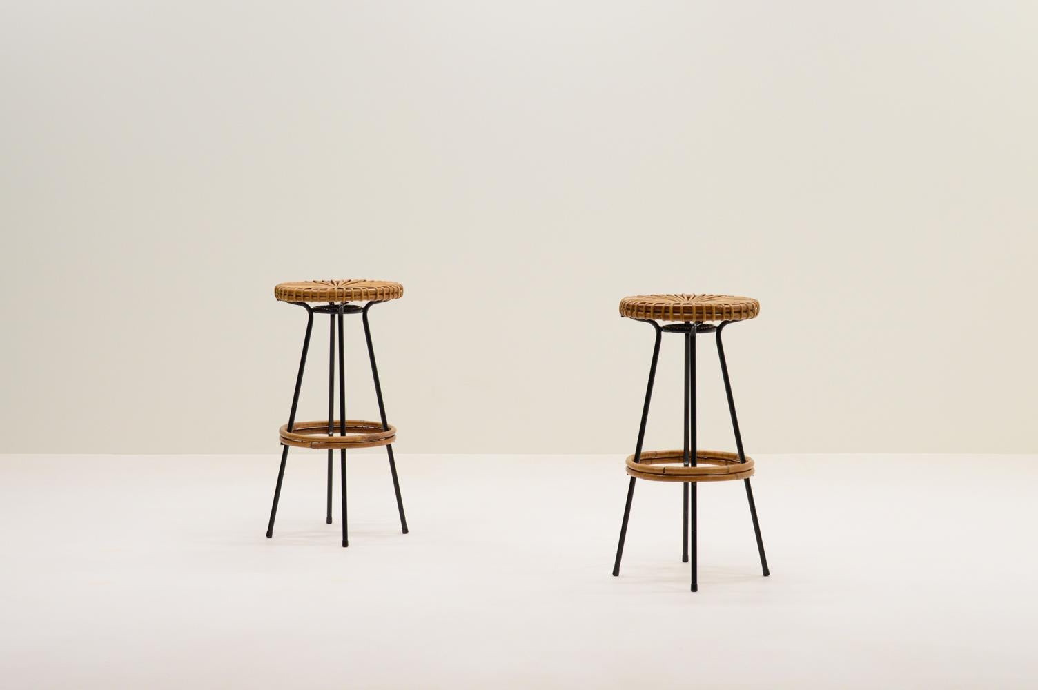 Set of 2 bar stools by Dirk van Sliedregt for Rohé Noordwolde, 1960s The Netherlands. Black laquered metal frame with rattan seat and footring. In very good vintage condition.

Request a quote for the latest shipping rates.