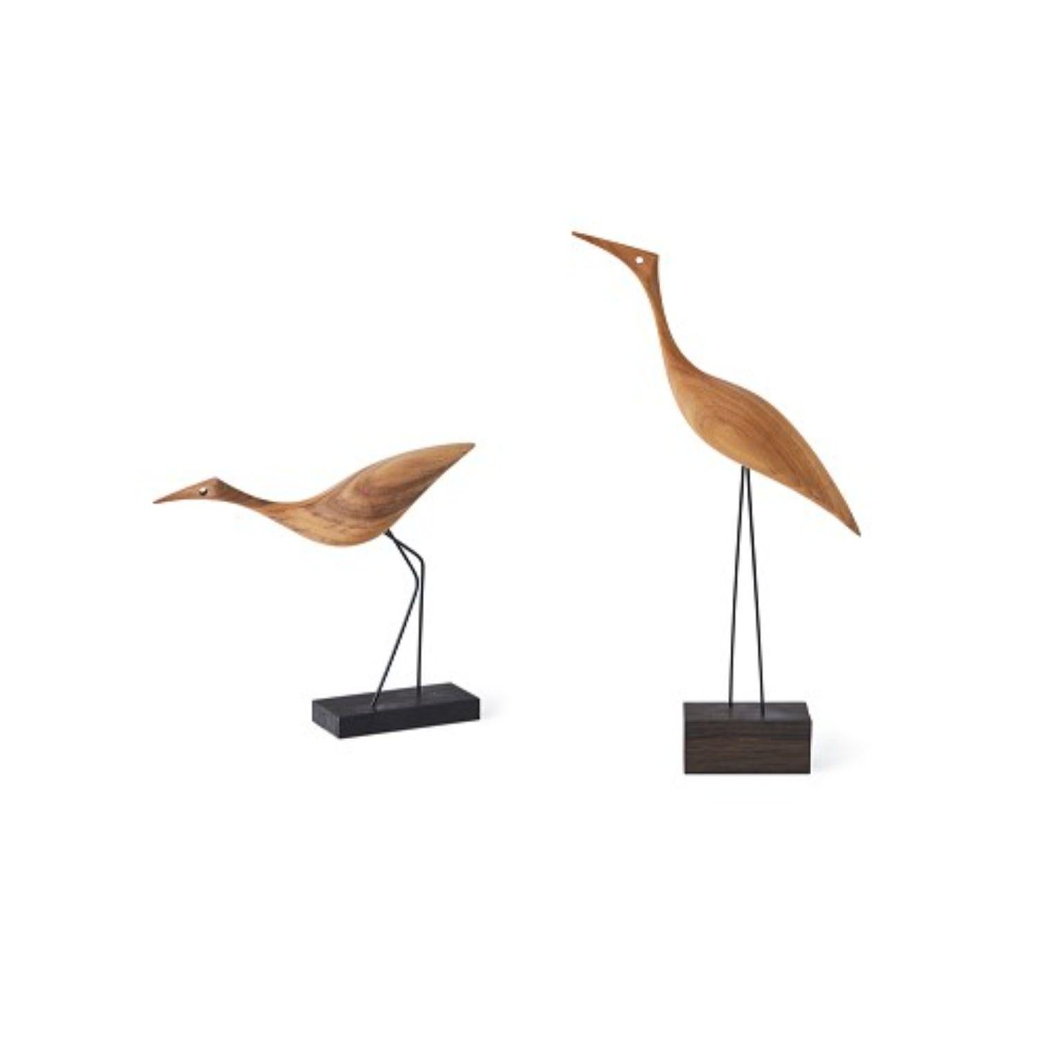 Set of 2 beak birds sculptures by Warm Nordic
Dimensions: 
Tall: D19 x W5,5 x H36 cm
Low: S20,5 x W5 x H19 cm
Material: Oiled Oak
Weight: 0.2 kg each
Also available in different variations.

Designed by Svend Aage Holm-Sørensen in