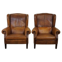 Set of 2 beautiful and well-maintained sheepskin leather wingback armchairs