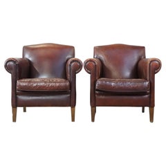 Set of 2 beautiful, finely finished design armchairs made of sheepskin