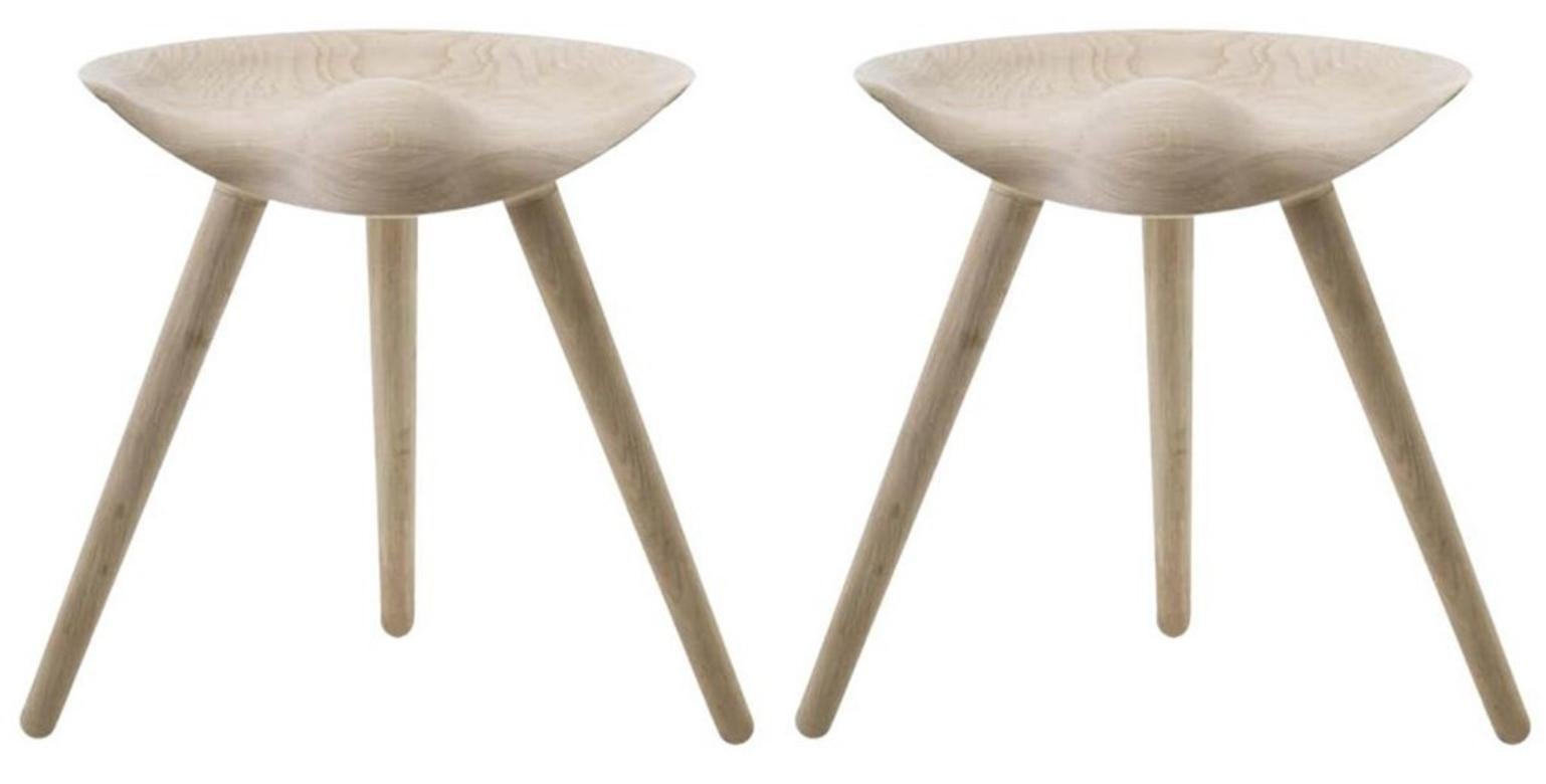 Set of 2 ML 42 beige oak stools by Lassen
Dimensions: H 48 x W 36 x L 55.5 cm
Materials: Oak

In 1942 Mogens Lassen designed the stool ML42 as a piece for a furniture exhibition held at the Danish Museum of Decorative Art. He took inspiration from
