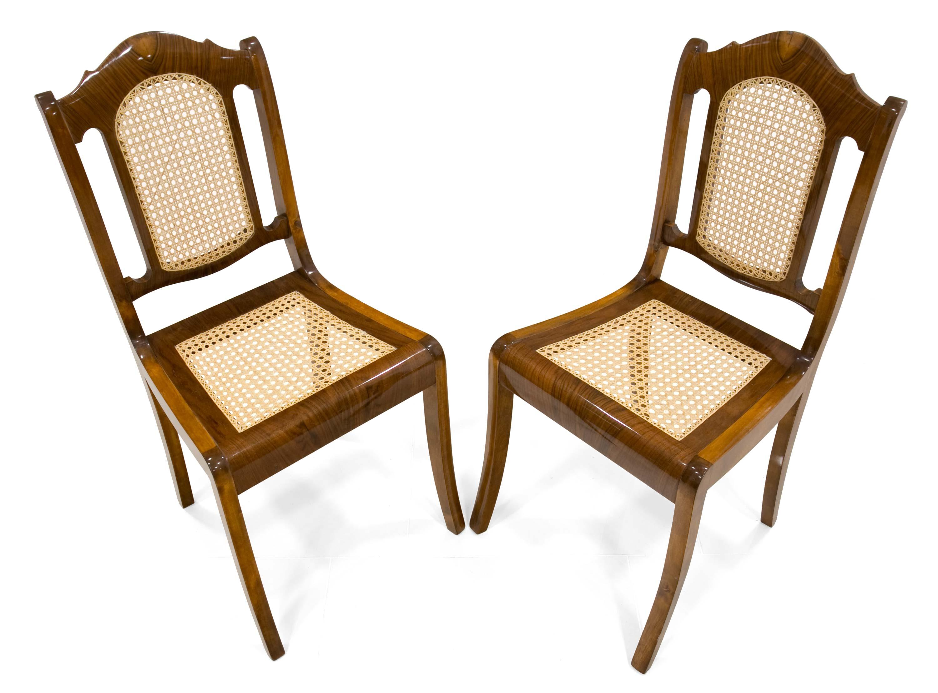 Two beautiful chairs in the Biedermeier style come from Germany, the middle of the 19th century. Made of walnut wood, partly on the seat and backrest veneered with walnut veneer. The set is after complete renovation, hand-polished. The seat and