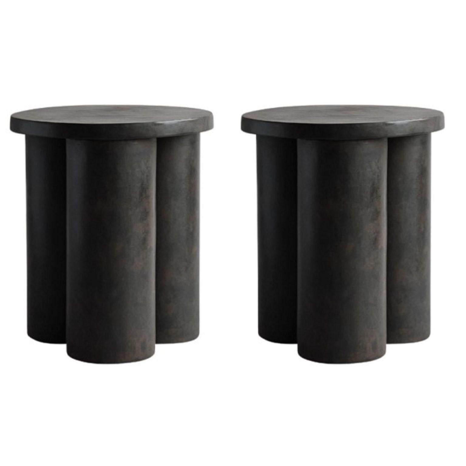 Set of 2 big foot tables tall by 101 Copenhagen
Designed by Kristian Sofus Hansen & Tommy Hyldahl
Dimensions: L 45 / W 45 /H 51 CM
Materials: fiber concrete

At first glance the Big Foots collection looks heavy and dense, yet on further inspection,