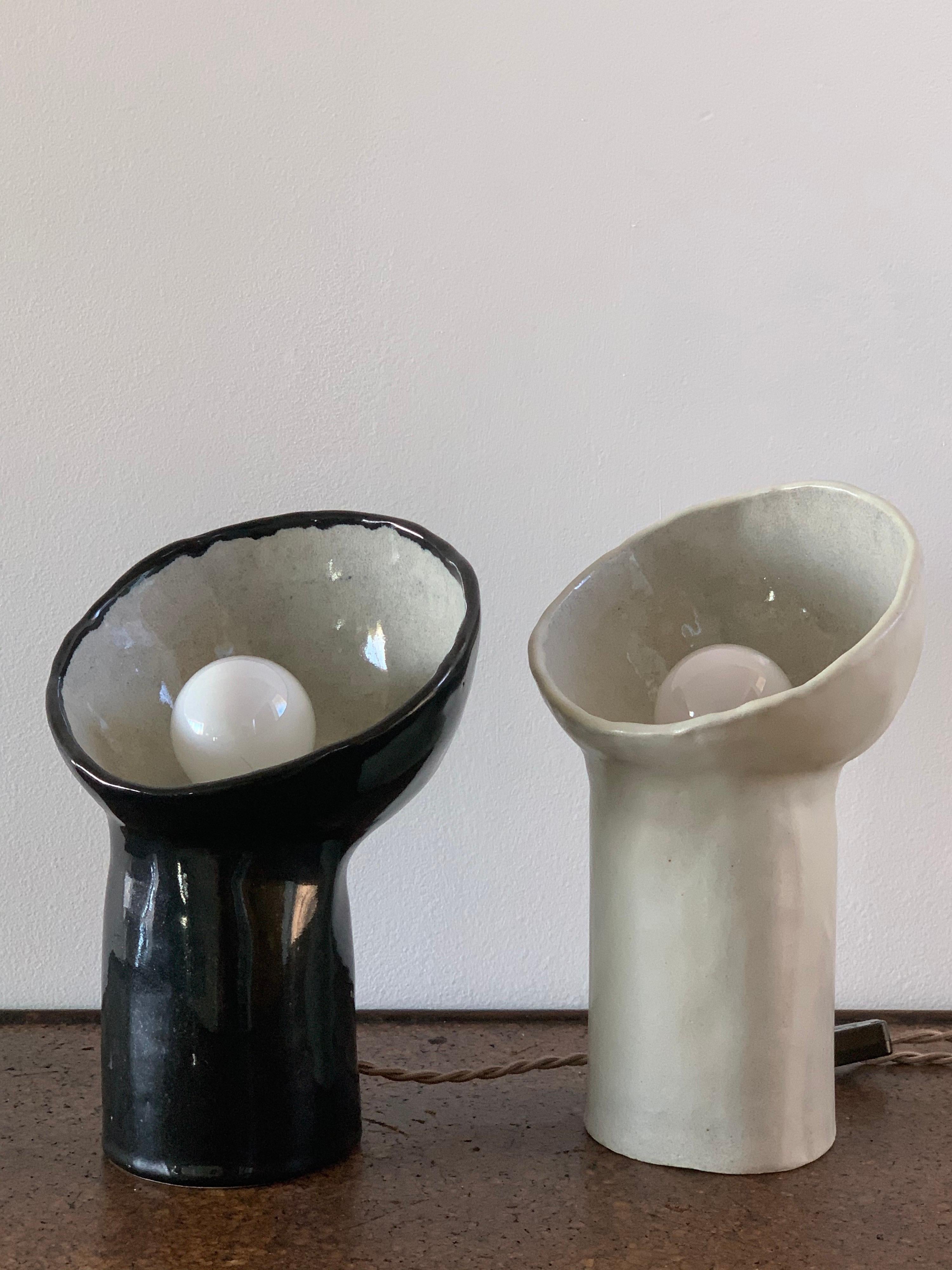Ceramic Set of 2 Black and White Cyclope Lamps For Sale