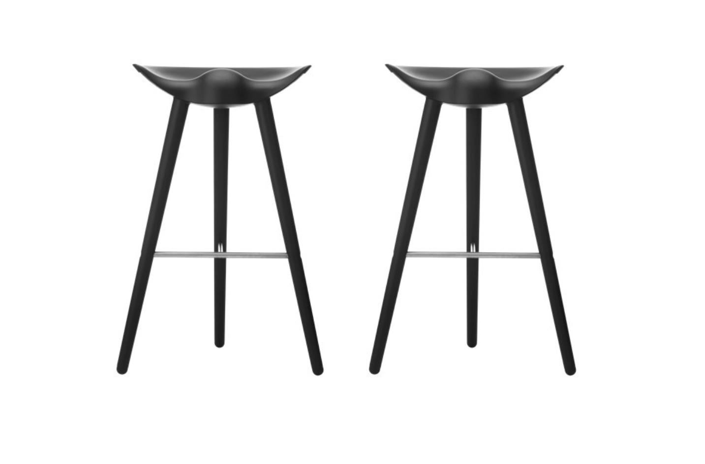 Set of 2 ML 42 black beech and stainless steel bar stools by Lassen
Dimensions: H 77 x W 36 x L 55.5 cm
Materials: beech, stainless steel

In 1942 Mogens Lassen designed the Stool ML42 as a piece for a furniture exhibition held at the Danish Museum