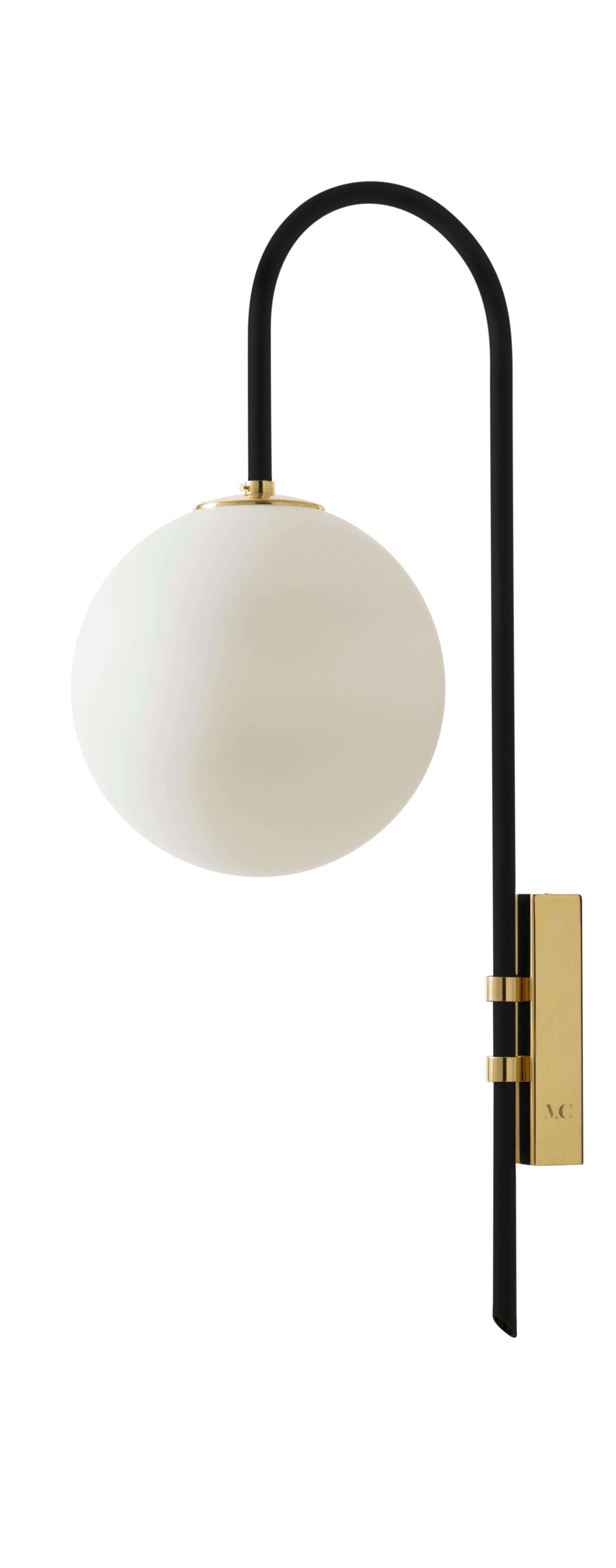 Set of 2 black brass wall lamp 06 by Magic Circus Editions
Dimensions: H 77 x W 25 x D 36.5 cm
Materials: Smooth brass, mouth blown glass
Sphere dimensions: 25 cm

Available finishes: Brass, nickel
All our lamps can be wired according to each