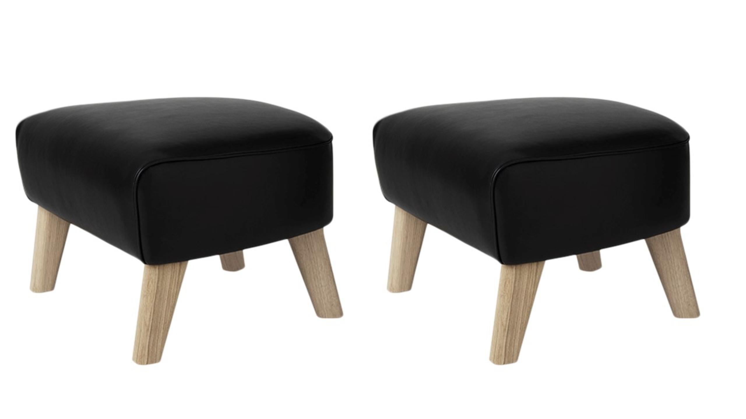 Set of 2 black leather and natural oak my own chair footstools by Lassen
Dimensions: W 56 x D 58 x H 40 cm 
Materials: Leather

The my own chair footstool has been designed in the same spirit as Flemming Lassen’s original iconic chair,