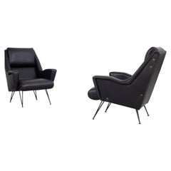 Set of 2 black leather armchairs by Figli di Renzo Minotti, Italy, 1950s.