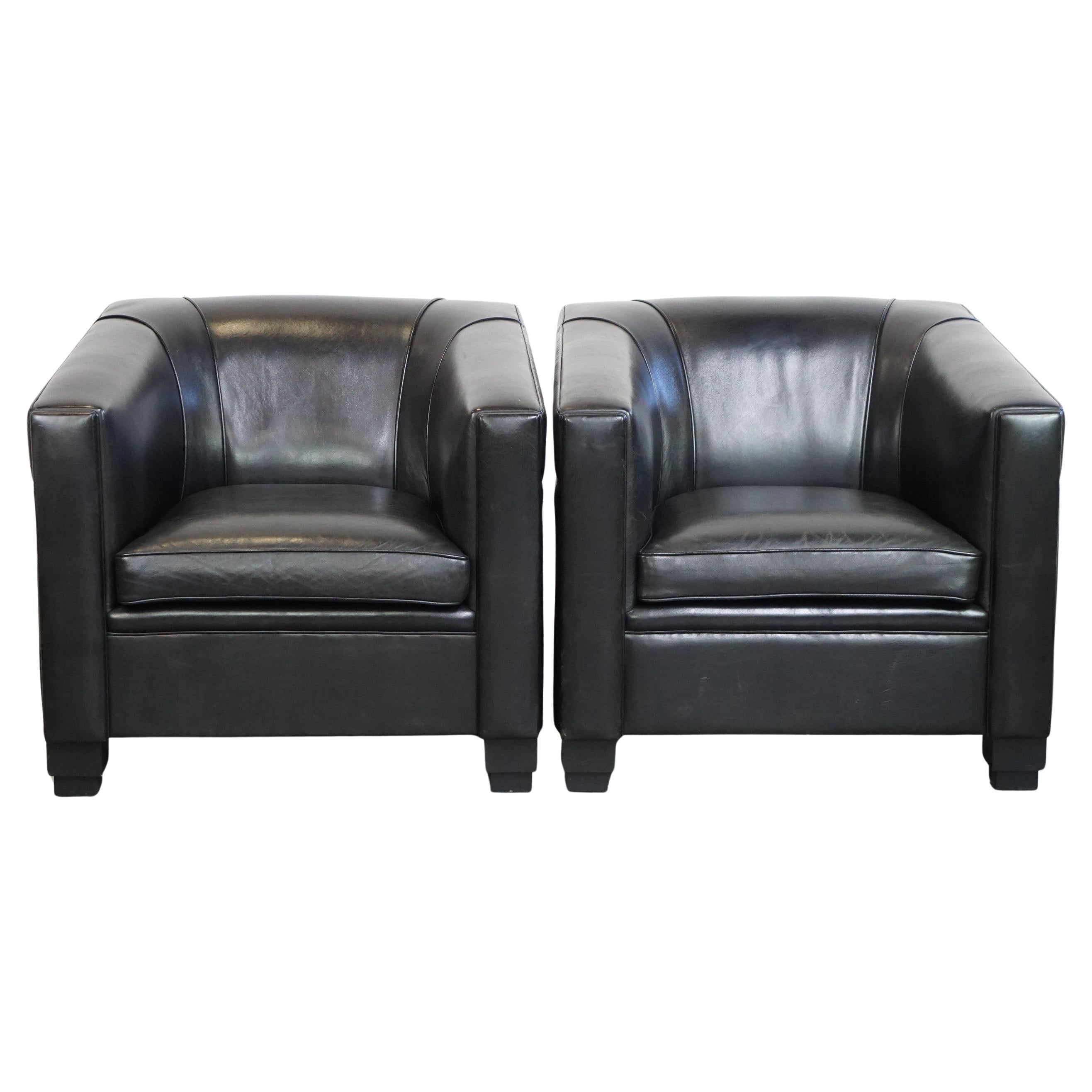 Set of 2 black sheepskin Art Deco design armchairs with high seating comfort