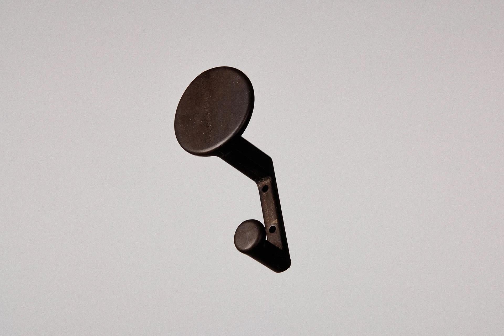 Set of 2 Blackened F.ACE Wall Hooks by Henry Wilson
Dimensions: W 6 x D 5 x H 10 cm
Materials: Blackened bronze.

Available in blackened, brass, and aluminum.

The F.ACE Hook is a riff on our popular Compass Hook. Sand-cast in solid brass, it was