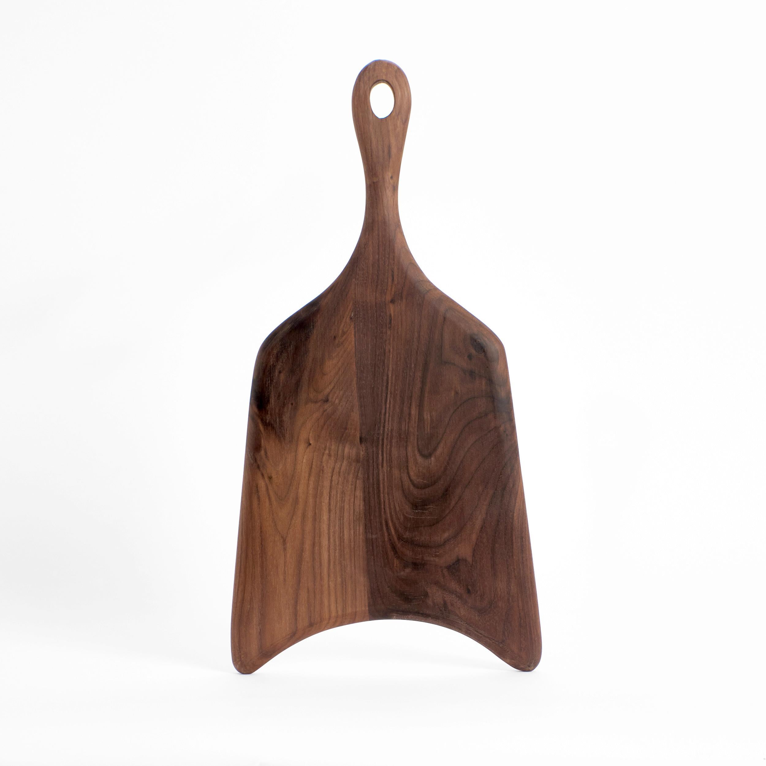 Set of 2 Board 56 in Walnut by Project 213A
Dimensions: D 56.5 x W 29 x H 2 cm
Materials: W alnut wood. 

This large shaped board is hand-carved from walnut. The boards as an individual or as part of the family will become a key item in every