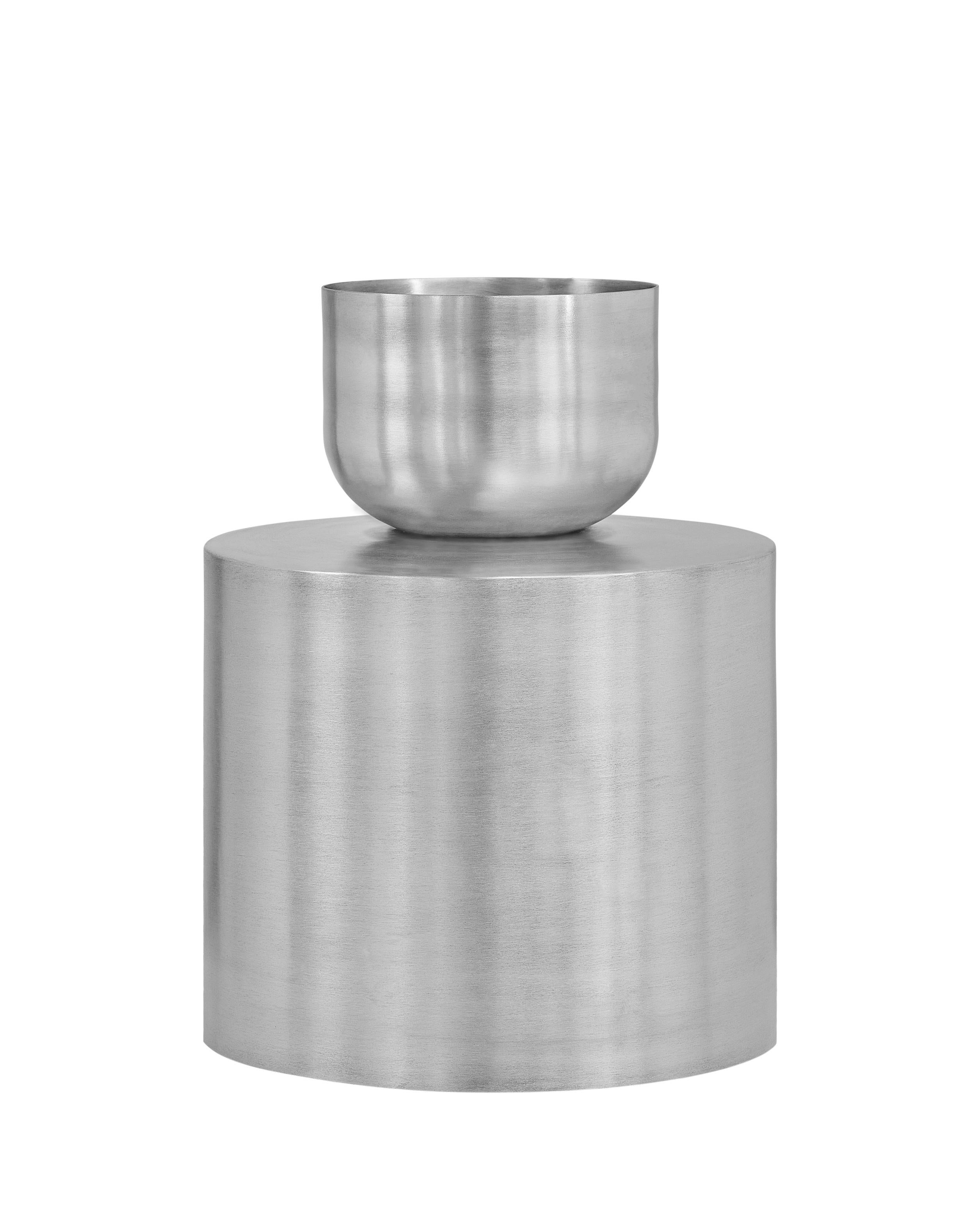 Set of 2 bold Ada Planters by Llot Llov
Dimensions: Ø 35 cm x H: 50 cm
Pot 1: Ø 35 cm x 30 cm; Pot 2: Ø 20 cm x 20 cm
Materials: brushed raw aluminium
Also available in black powder-coated.
Ada Planter was made in a metal spinning process out of