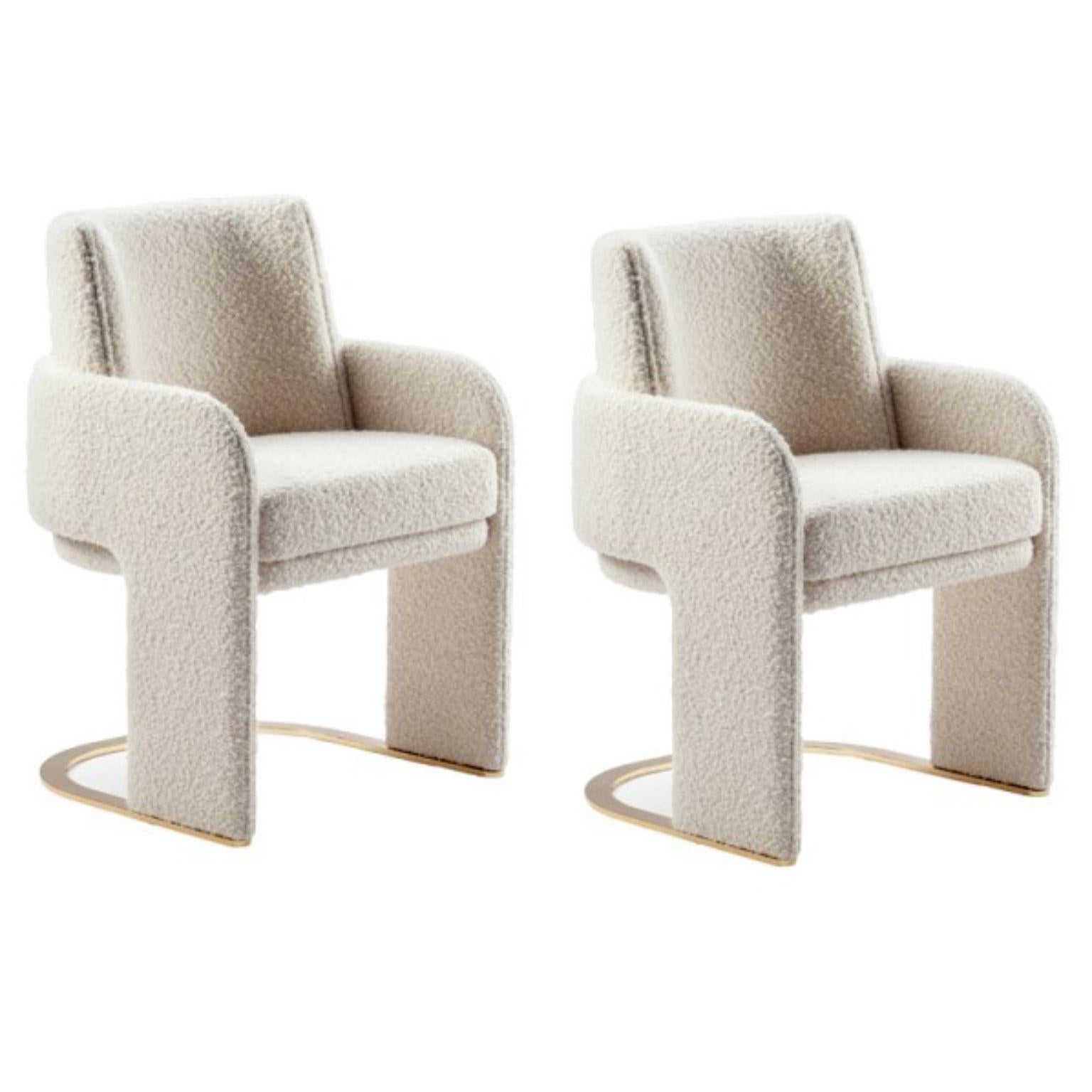 Set of 2 Bouclé Odisseia Chairs by Dooq
Dimensions
W 54 x D 55 x H 85 x Seat H 48 cm

Materials & Finishes
Base and feet in stainless steel plated polished or satin: brass, copper or nickel. Upholstery: seat, armrests and back fully upholstered