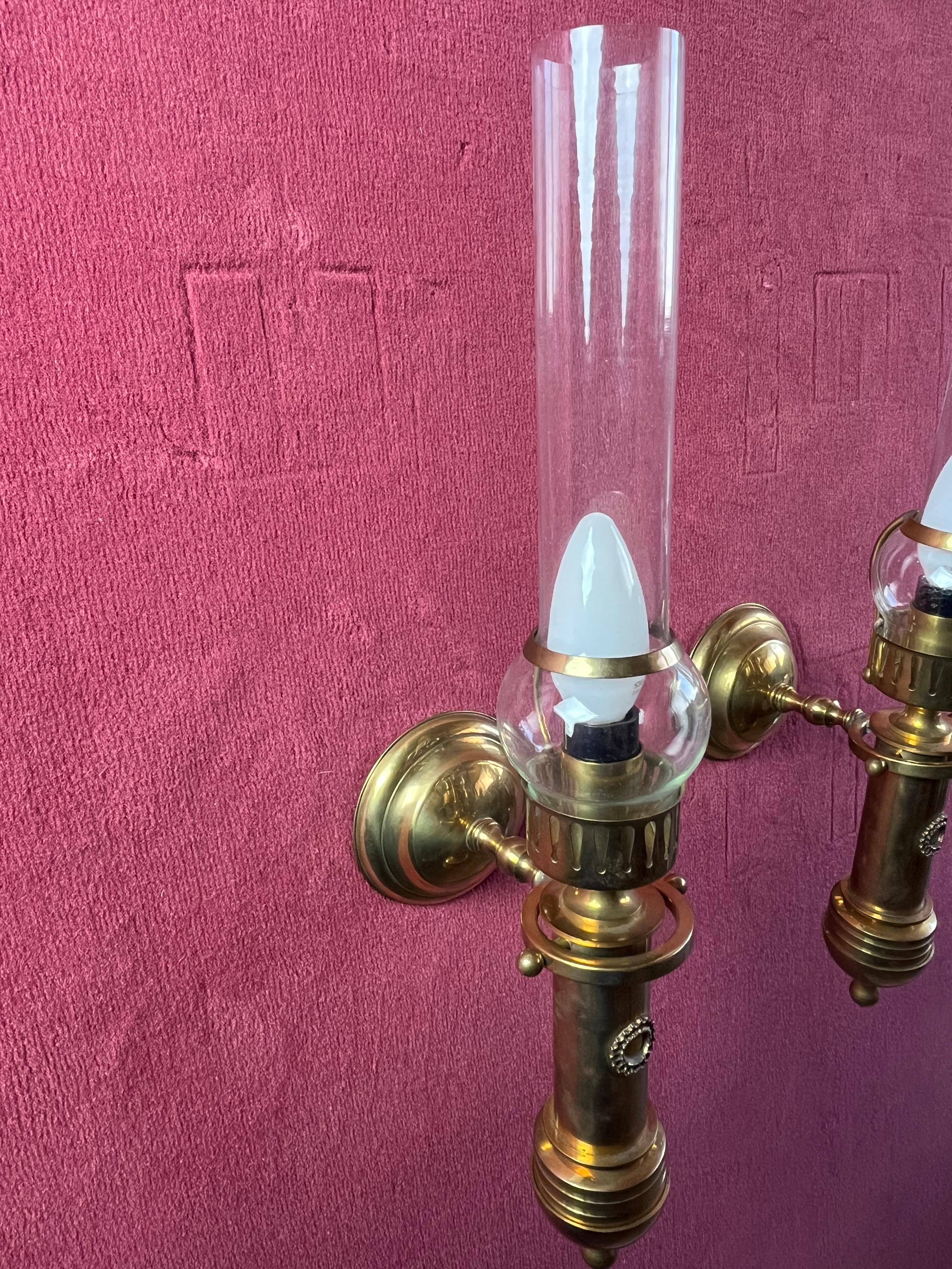 Set of 2 brass and glass wall lamps 1980s
Intact and working, good condition, E14 lamps.

We guarantee adequate packaging and will ship via DHL, insuring the contents against any breakage or loss of the package.