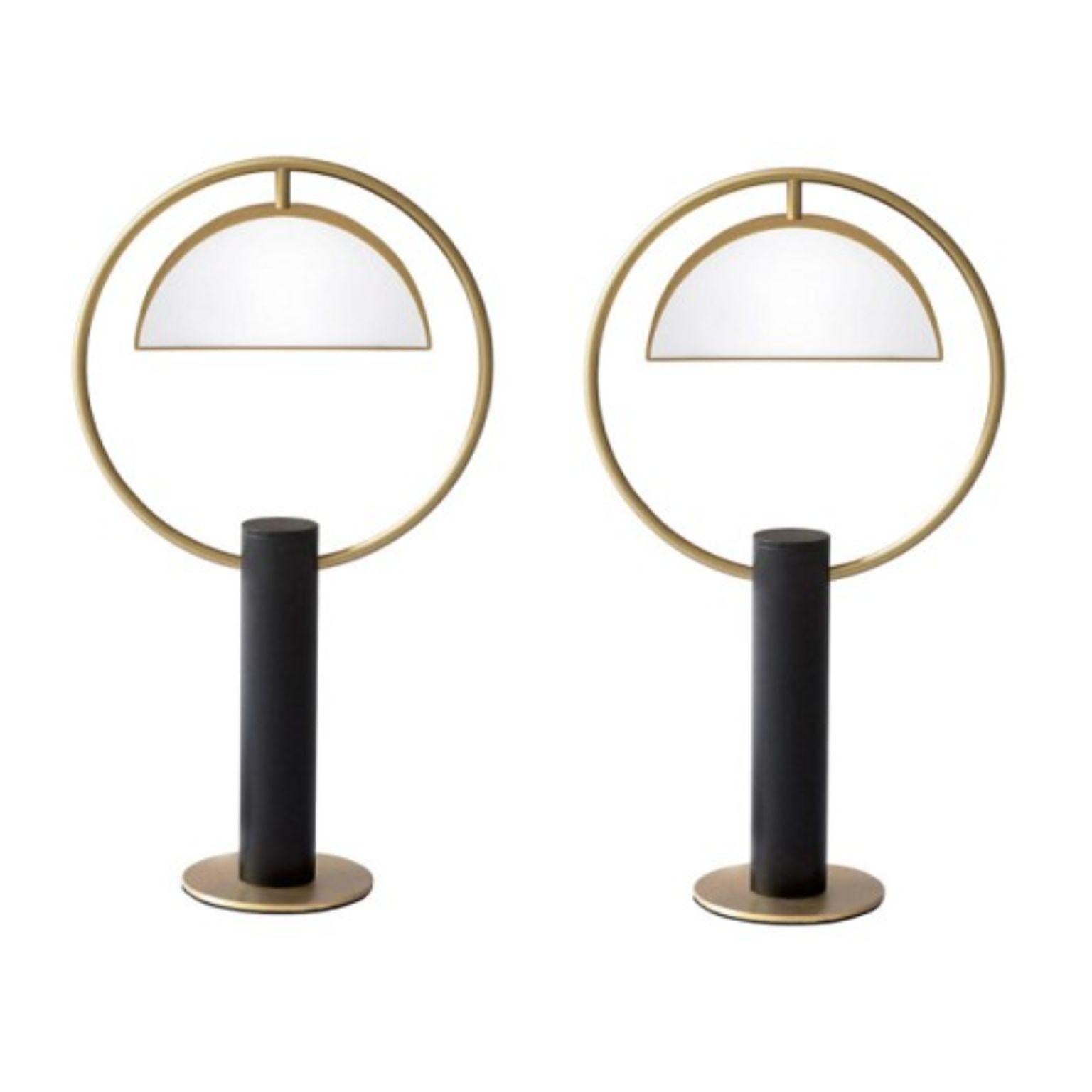 Set of 2 brass half in circle table lamps by Square in Circle
Dimensions: H 55 x W 30 x D 5 cm
Materials: Brushed brass finish, white frosted glass, dark grey metal  

Inspired by costume design from the Triadic Ballet by Oscar Schlemmer,