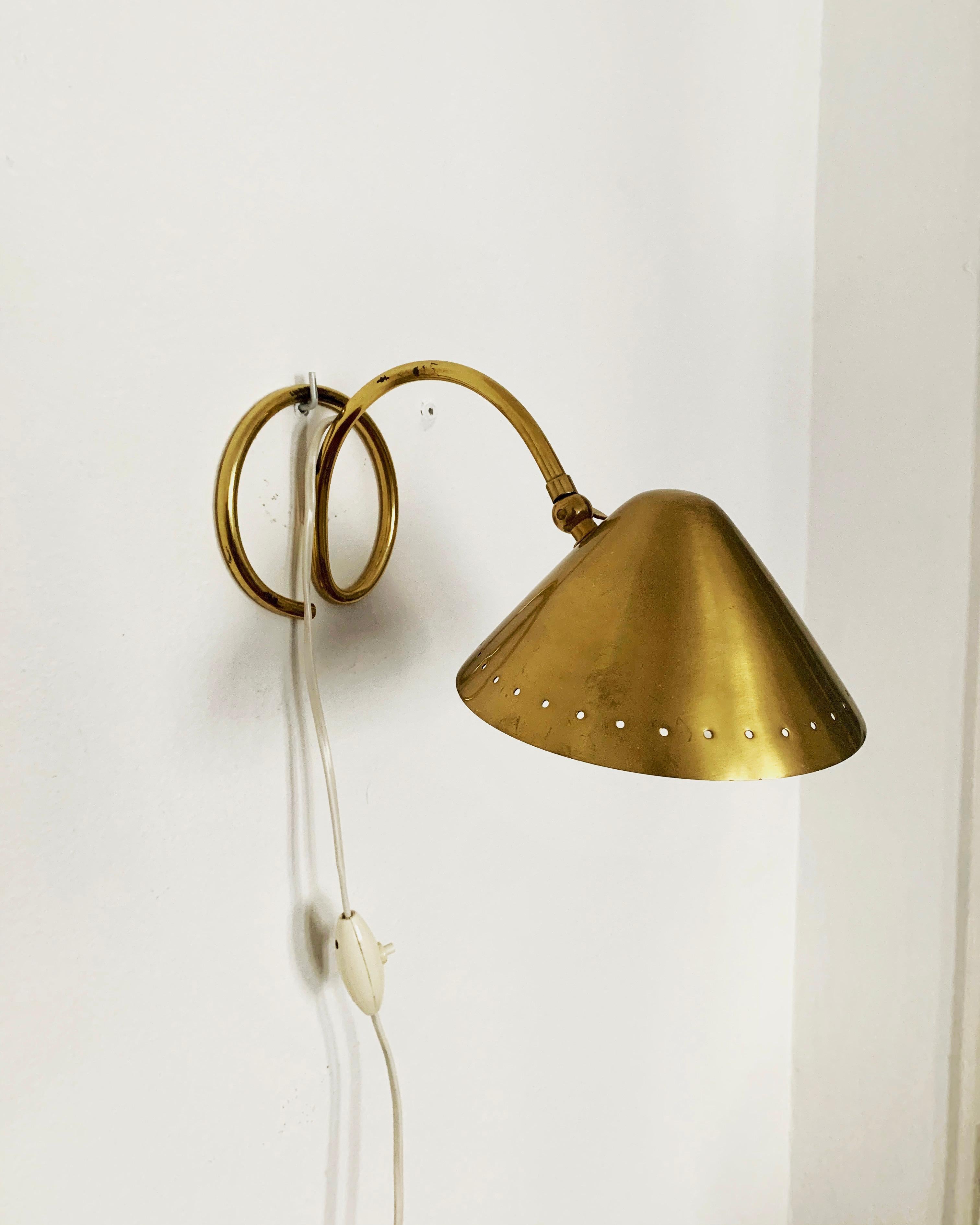 Charming brass table lamps from the 1950s.
Particularly beautiful design and an enrichment for every home.
Can also be used flexibly as wall lamps, for example in the bedroom.
A wonderful light emerges.

Condition:

Very good vintage condition with