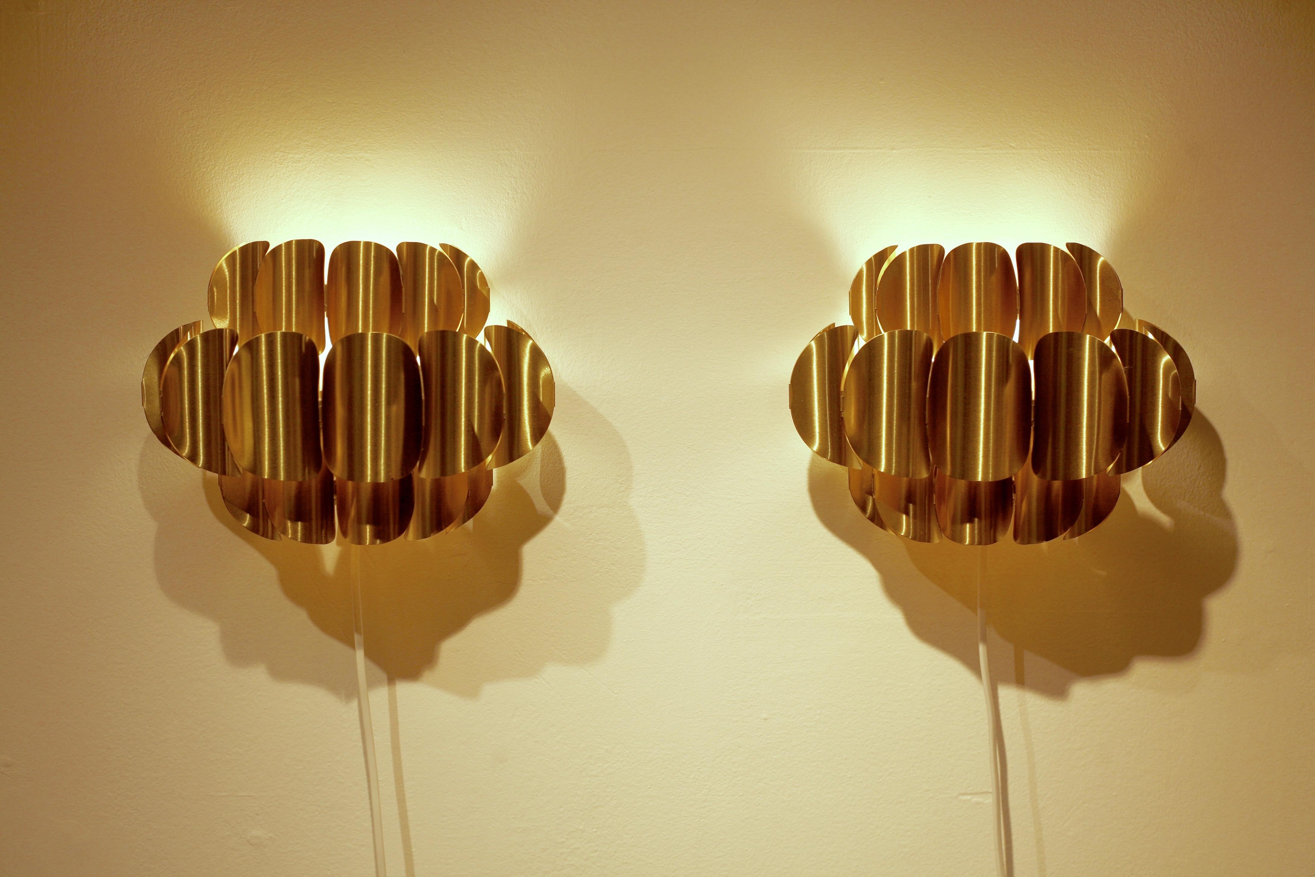 A set of 2 brass wall sconces, modell COR 74, designed by Werner Schou for Coronell Elektro. These are sometimes attributed to Hans-Agne Jakobsson.
