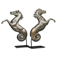 Set of 2 bronze seahorses on a stand