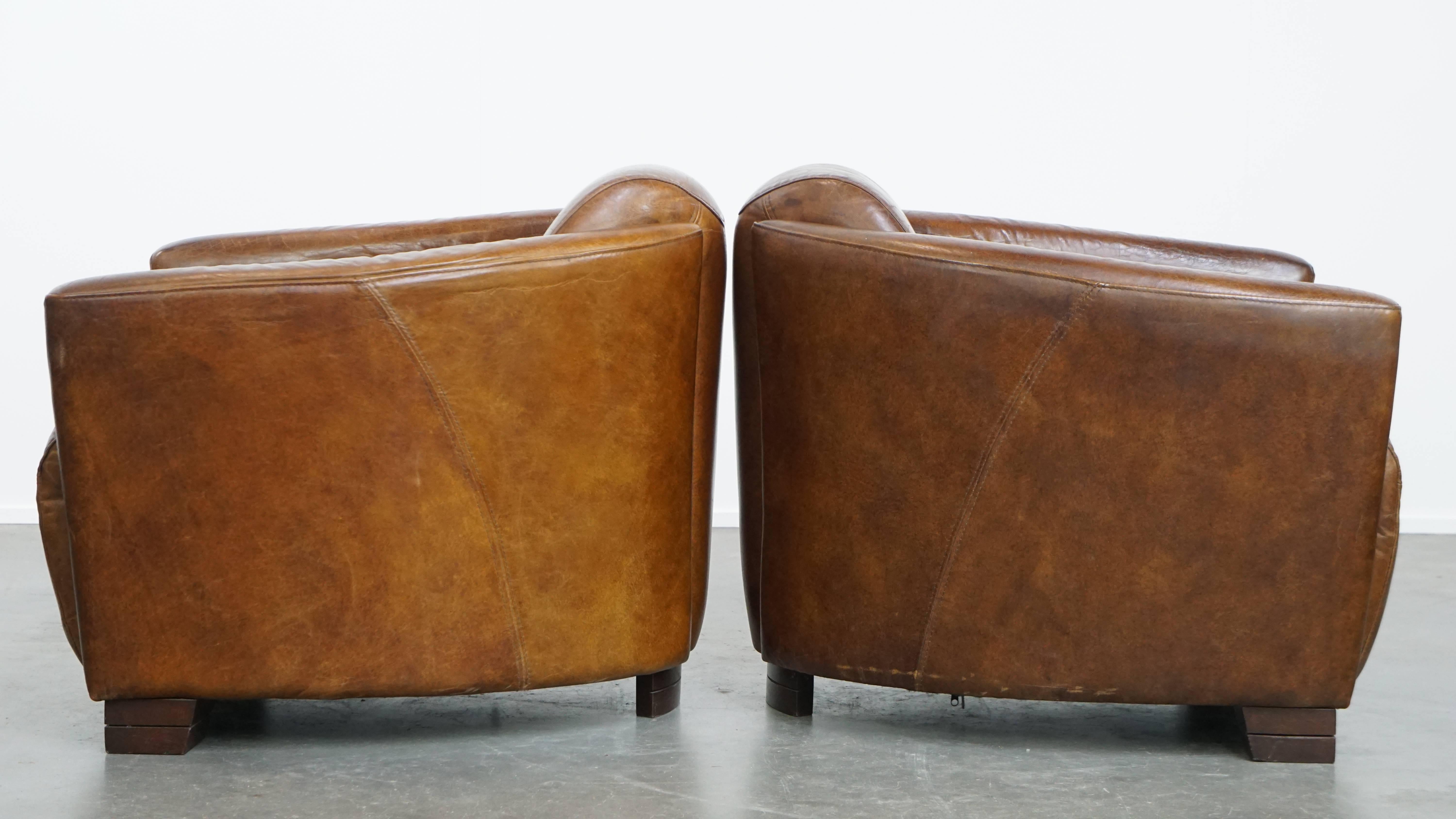 Hand-Crafted Set of 2 brown cowhide leather Aviator design armchairs For Sale