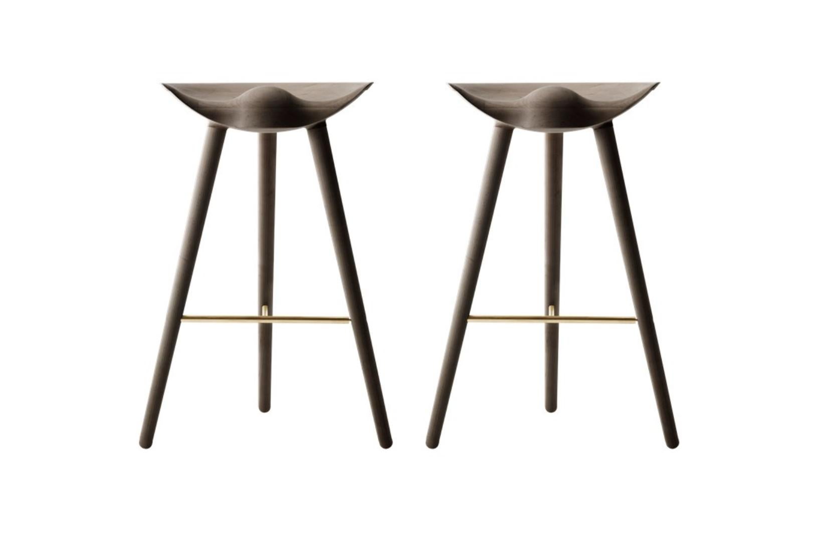 Set Of 2 Brown Oak and Brass Bar Stools by Lassen
Dimensions: H 77 x W 36 x L 55.5 cm
Materials: Oak, Brass

In 1942 Mogens Lassen designed the Stool ML42 as a piece for a furniture exhibition held at the Danish Museum of Decorative Art. He took