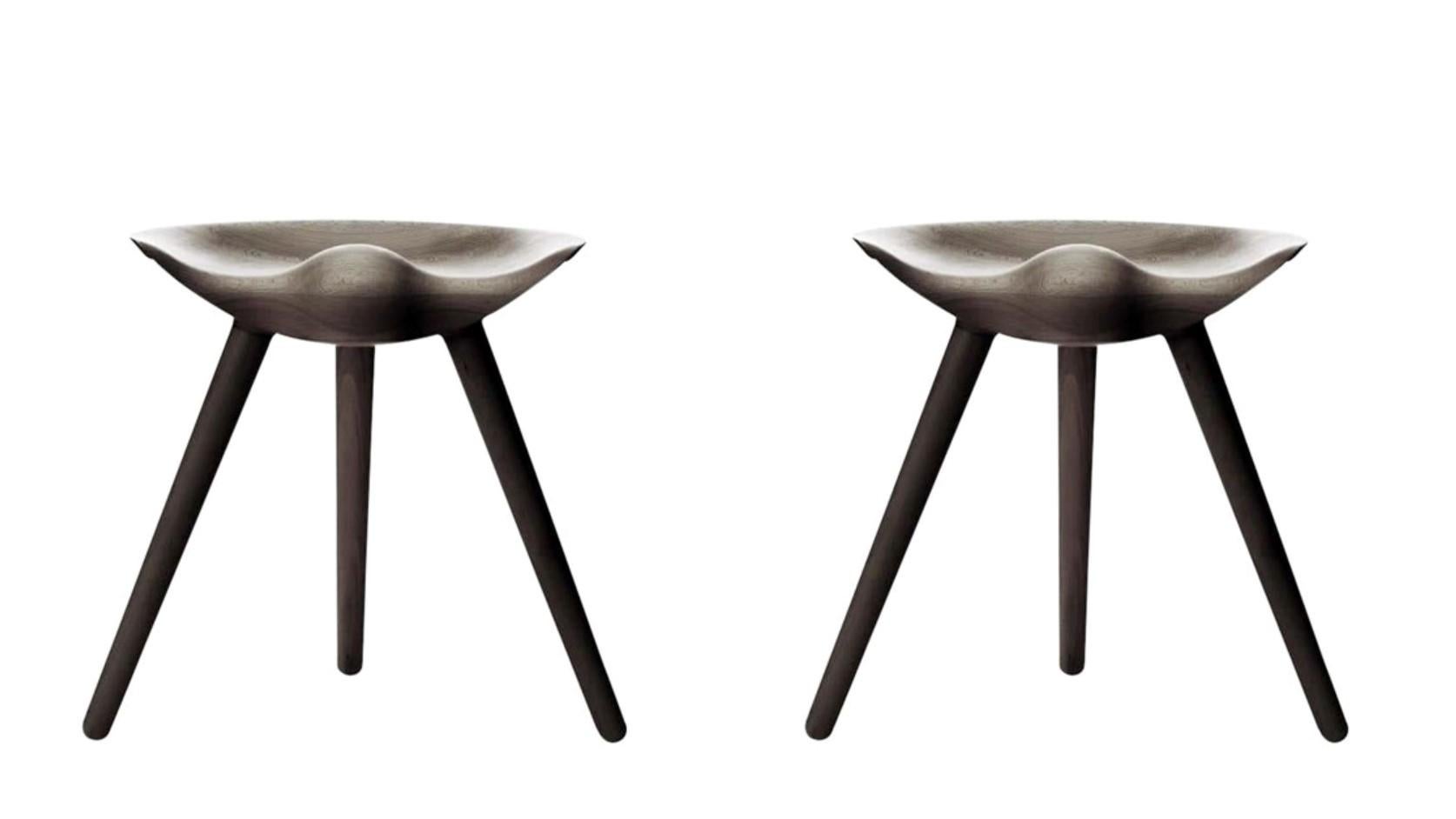 Set Of 2 Brown Oak Stools by Lassen
Dimensions: H 48 x W 36 x L 55.5 cm
Materials: Oak

In 1942 Mogens Lassen designed the Stool ML42 as a piece for a furniture exhibition held at the Danish Museum of Decorative Art. He took inspiration from the
